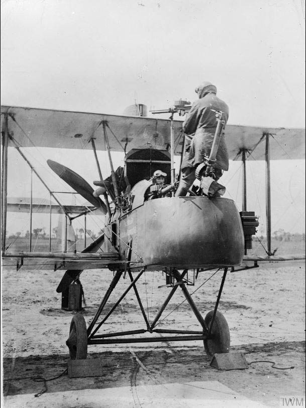 Lt Cambray and Capt Stevens of 20 Squadron demonstrating the FE2B observer's firing position against hostile aircraft approaching from behind (1917) Imperial War Museum Q69650