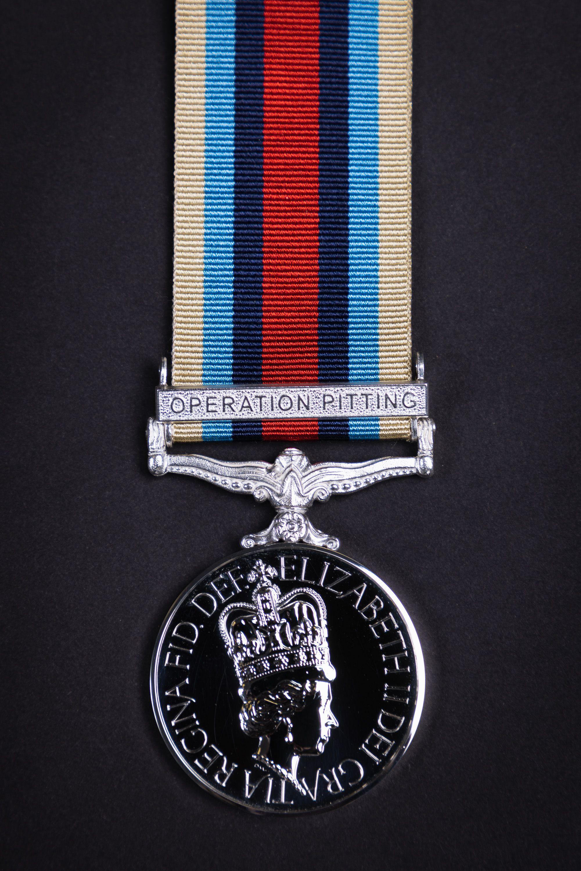 Medal with OPERATION PITTING engraved on.