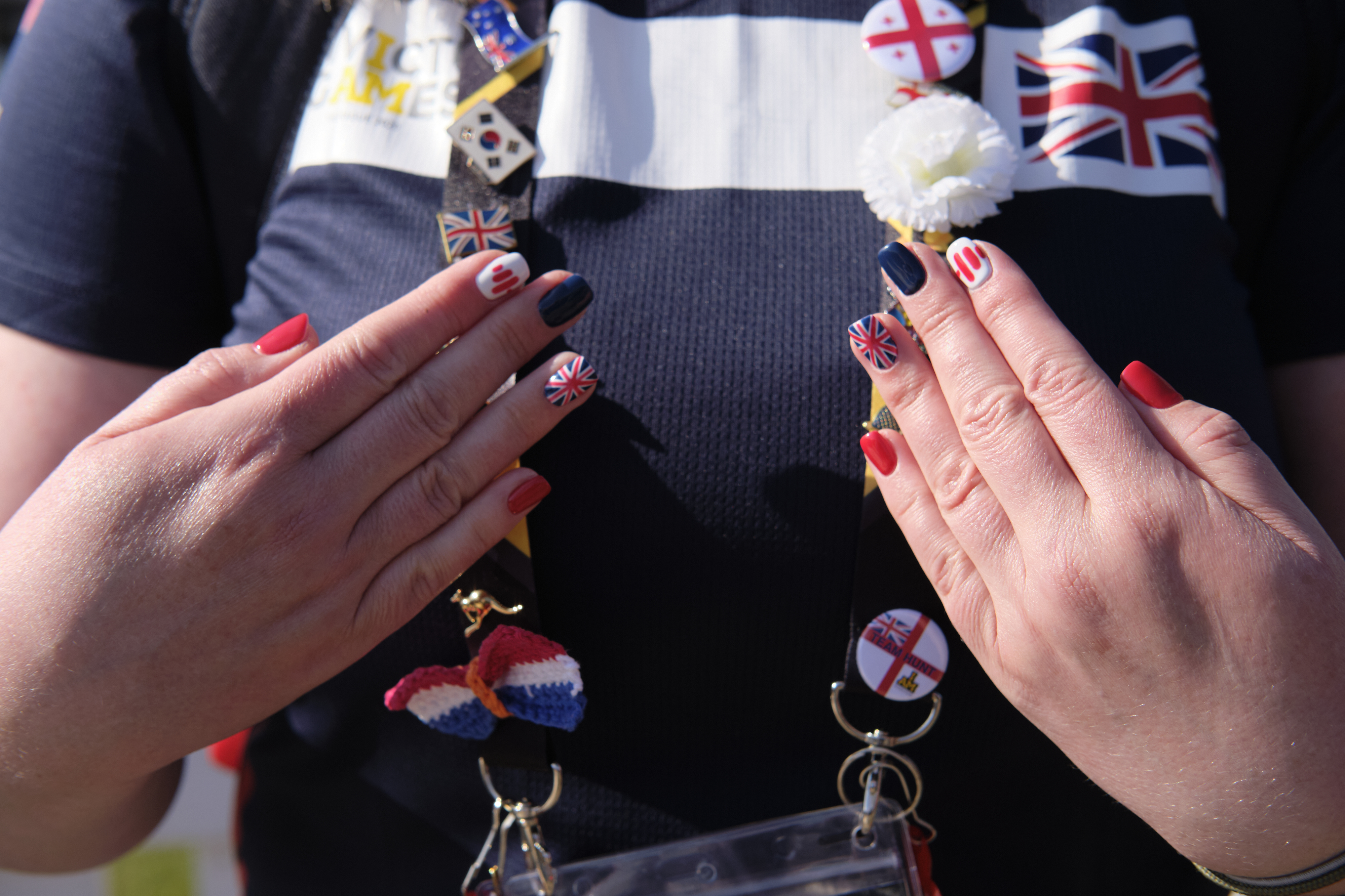 Hands with UK themed nail art.