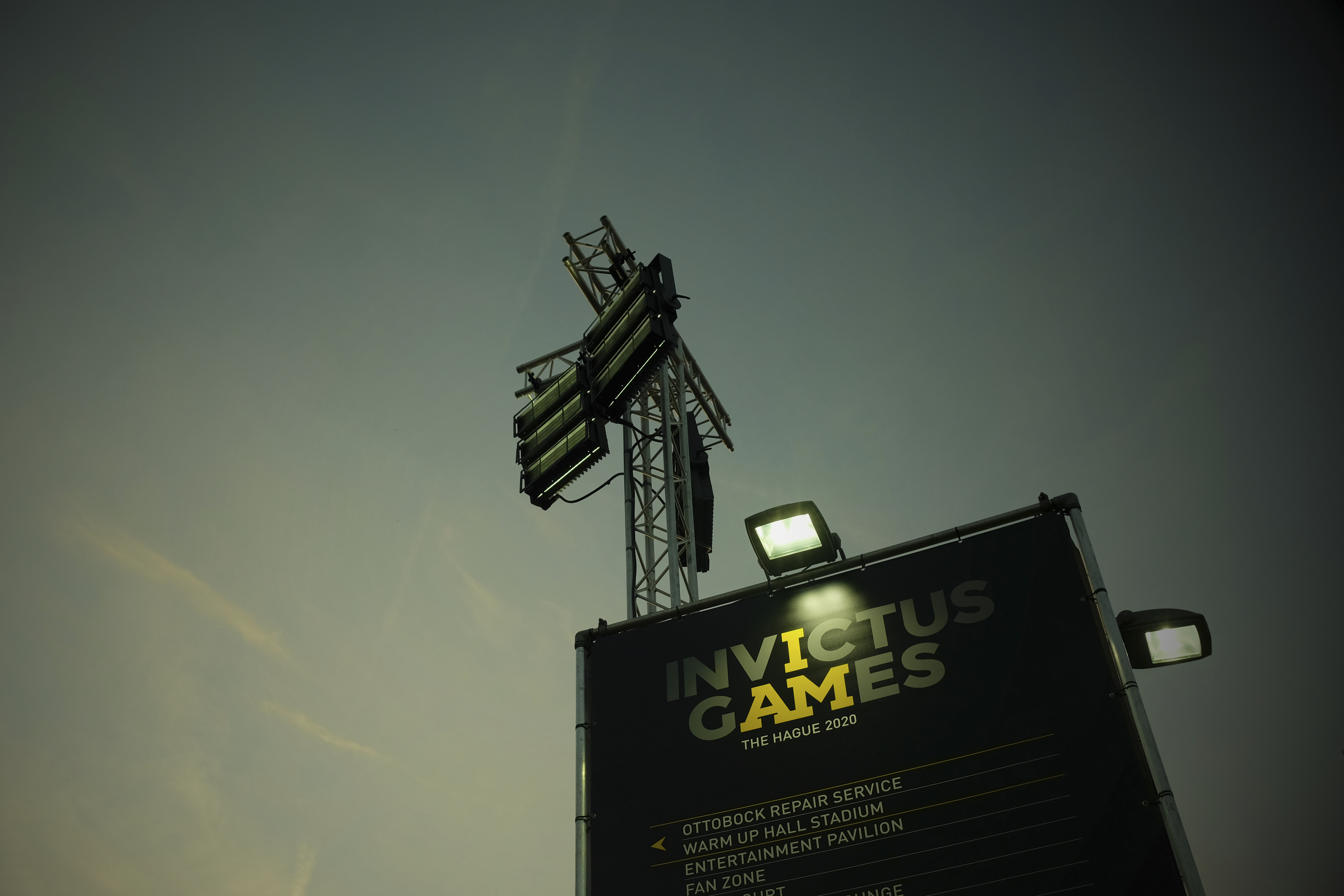 Spotlights highlight advertising stand for the Invictus Games.