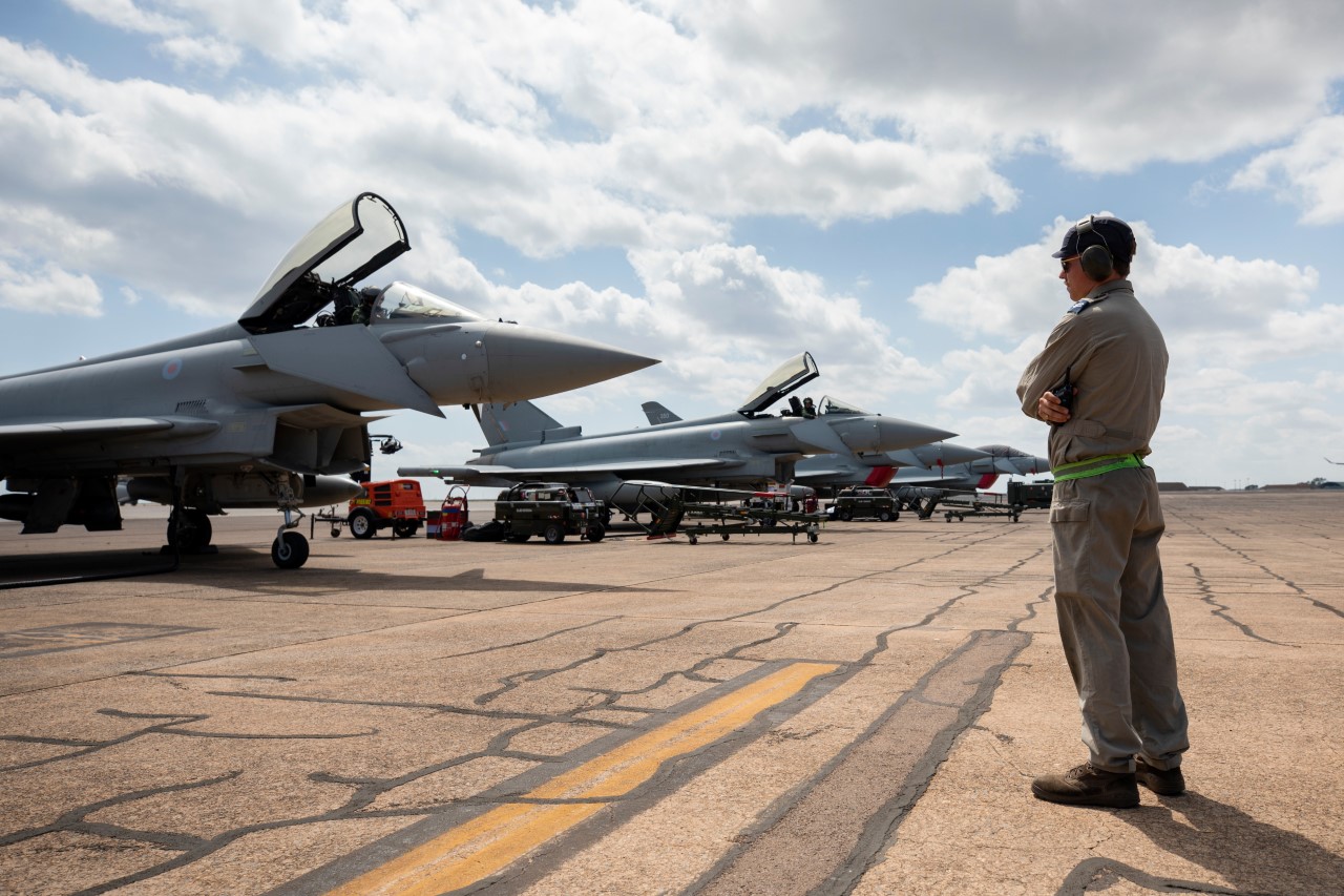 Royal Air Force (RAF) maintainer Corporal David Fenton, prepares to marshal a RAF Eurofighter Typhoon during Exercise Pitch Black 2022, at RAAF Base Darwin