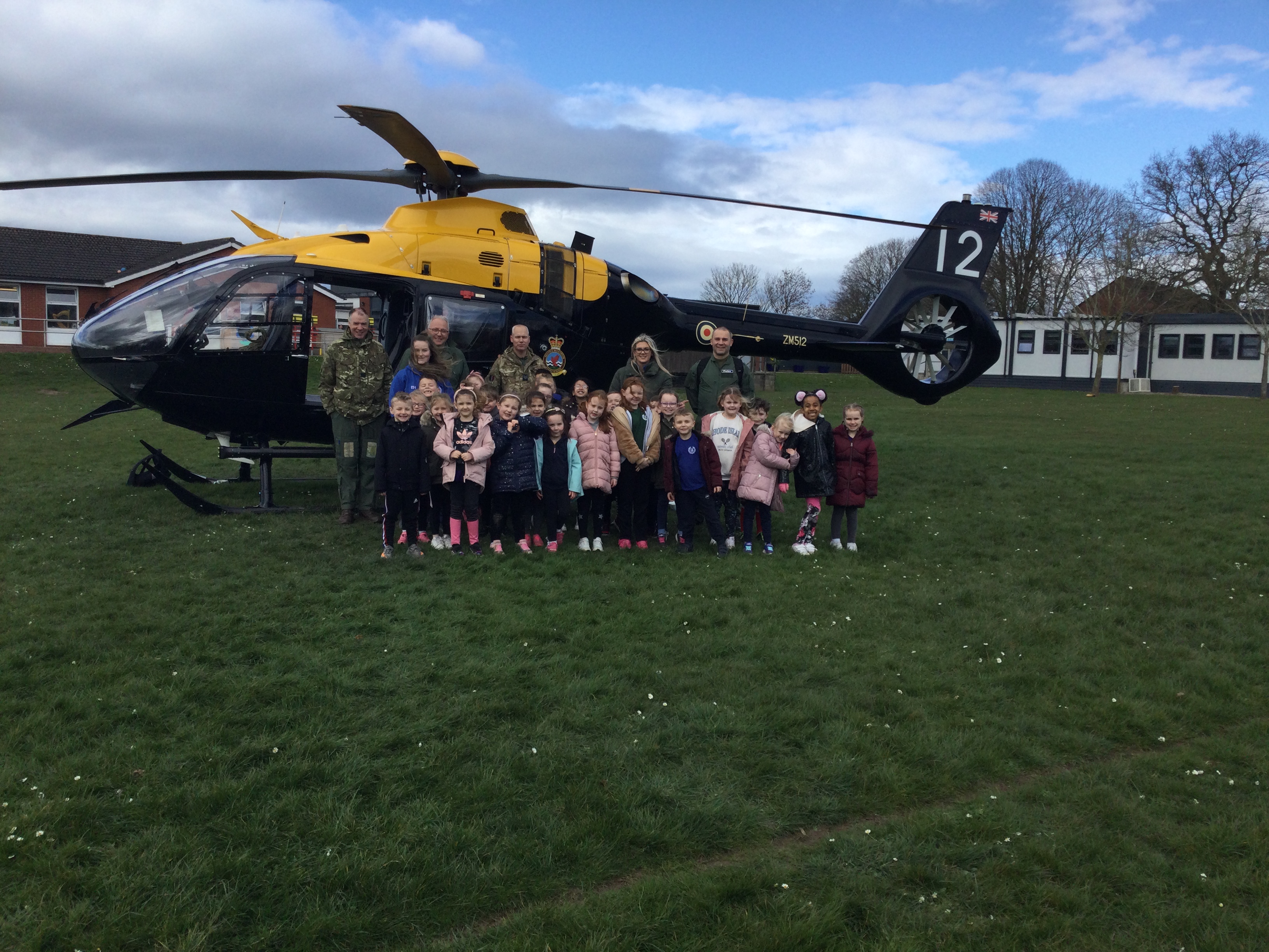 Juno Helicopter on the ground with school children. 