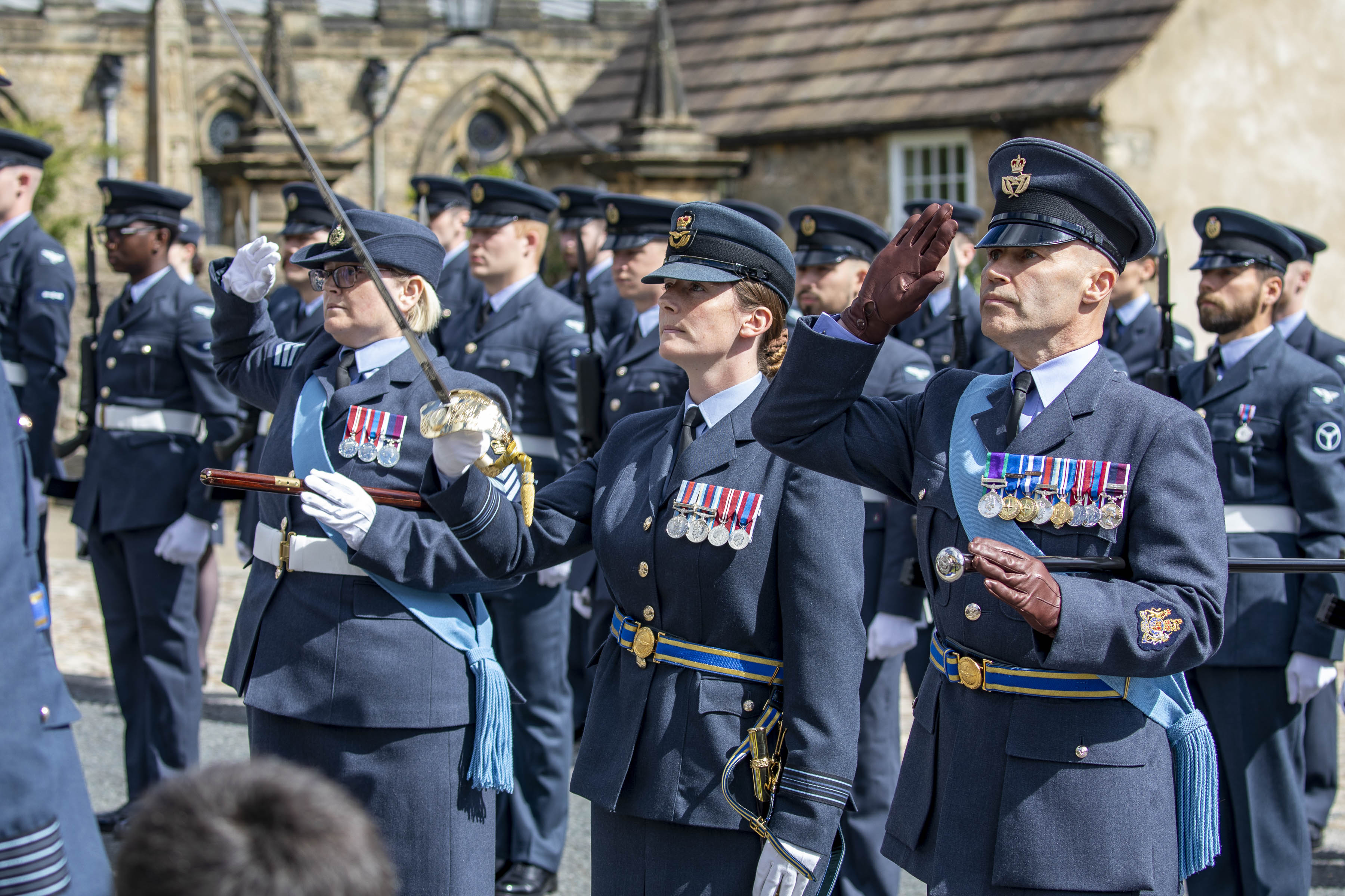 Image shows RAF aviators in parade with sword.