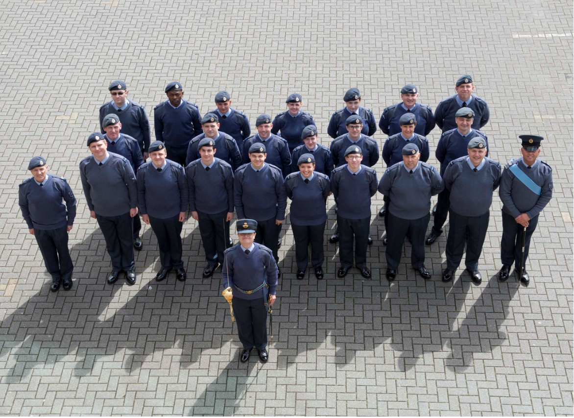 Image shows RAF personnel standing in formation for photo.
