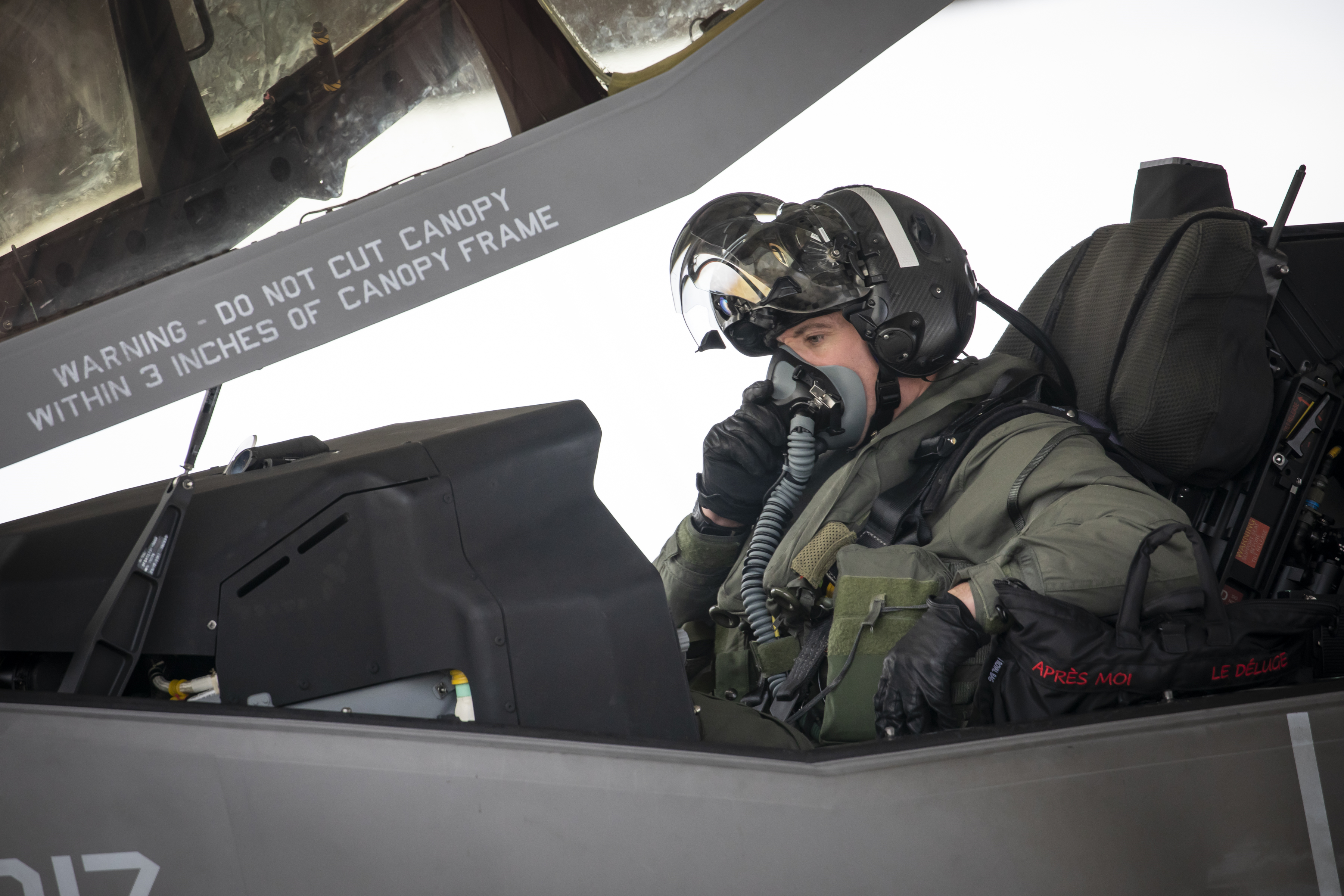 Image shows RAF Pilot inside the open cockpit of a Lightning aircraft.
