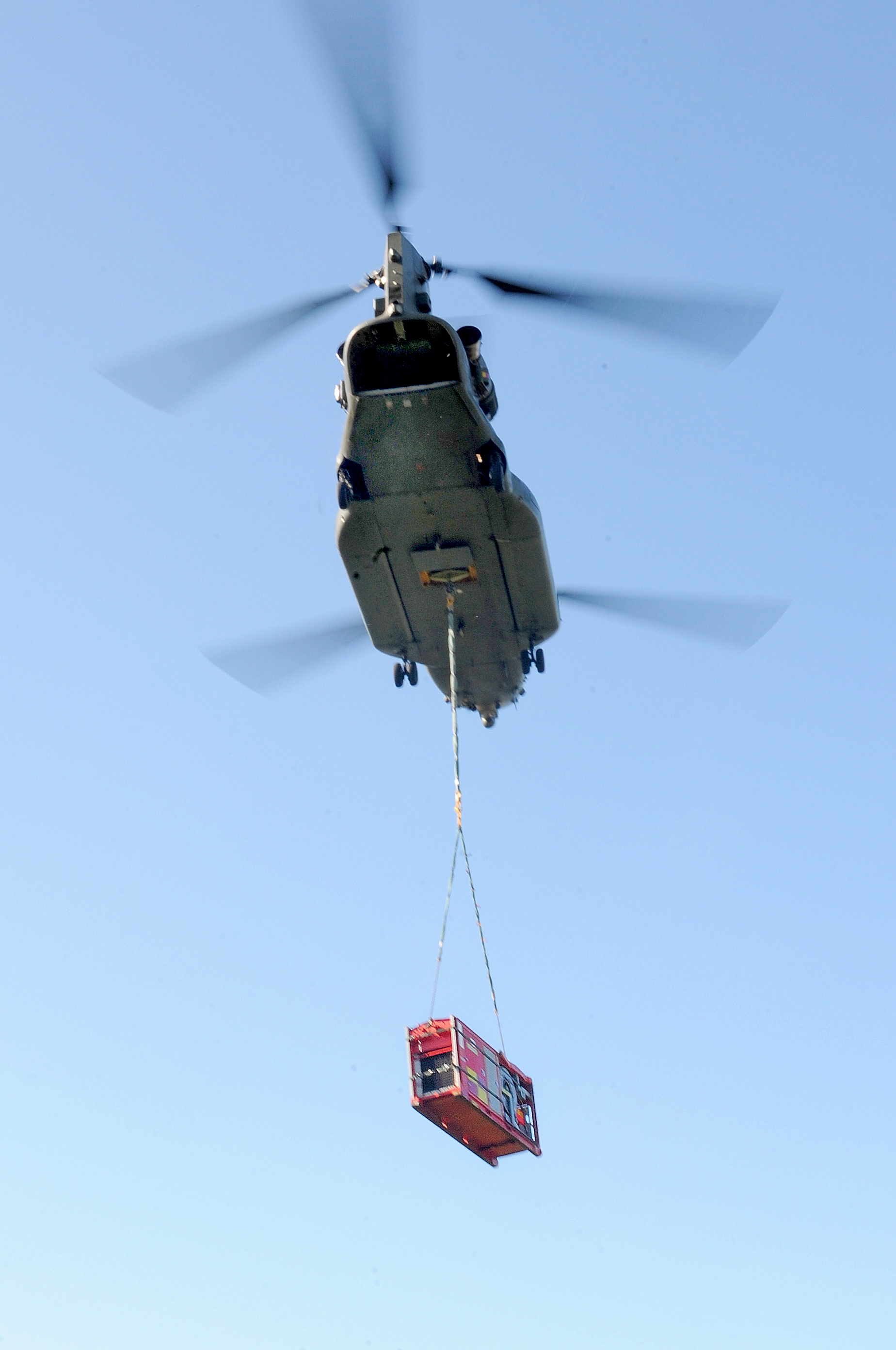 Image shows Chinook with under slung cargo in flight.