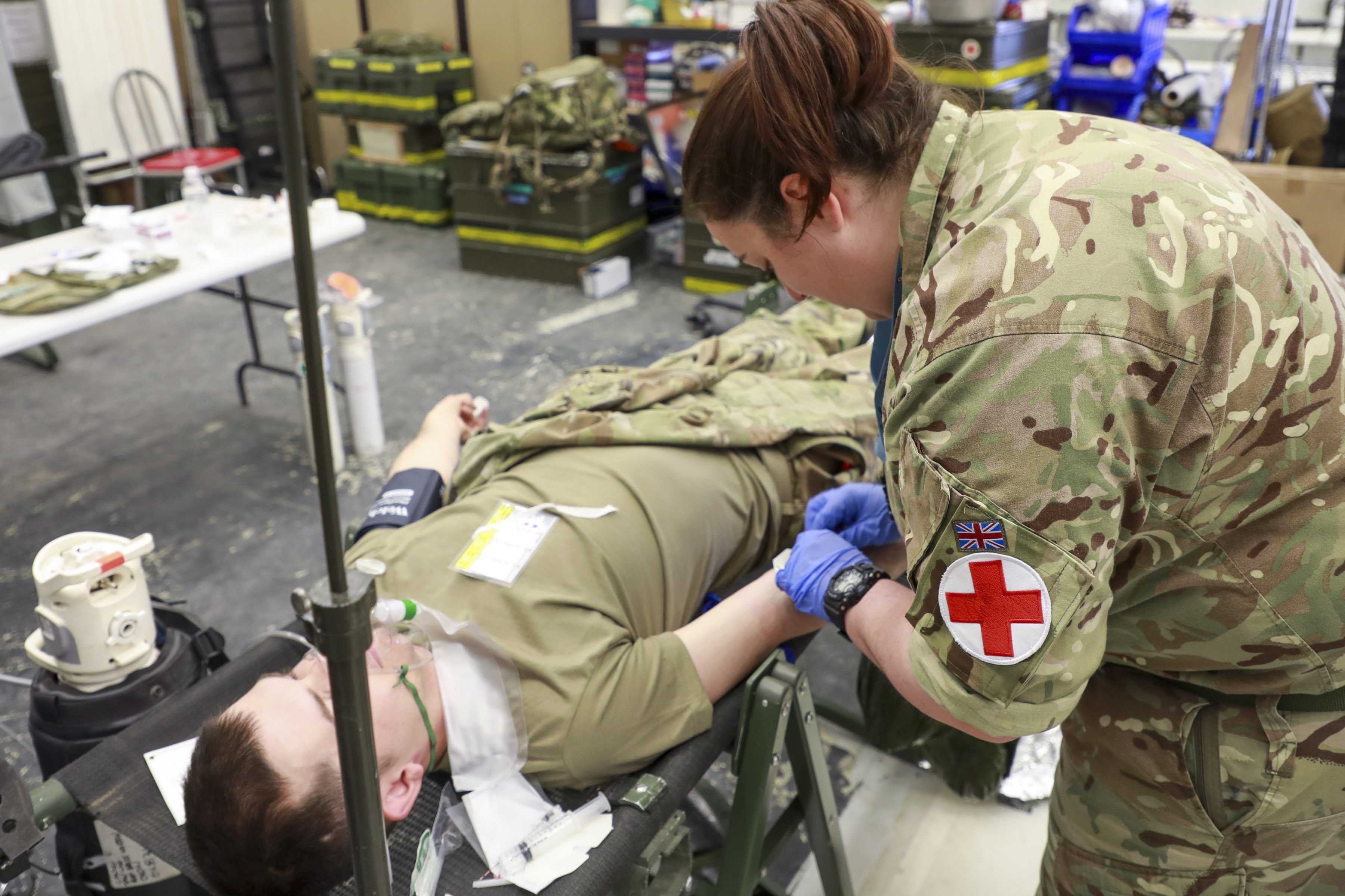 Medical personnel works with casualty.