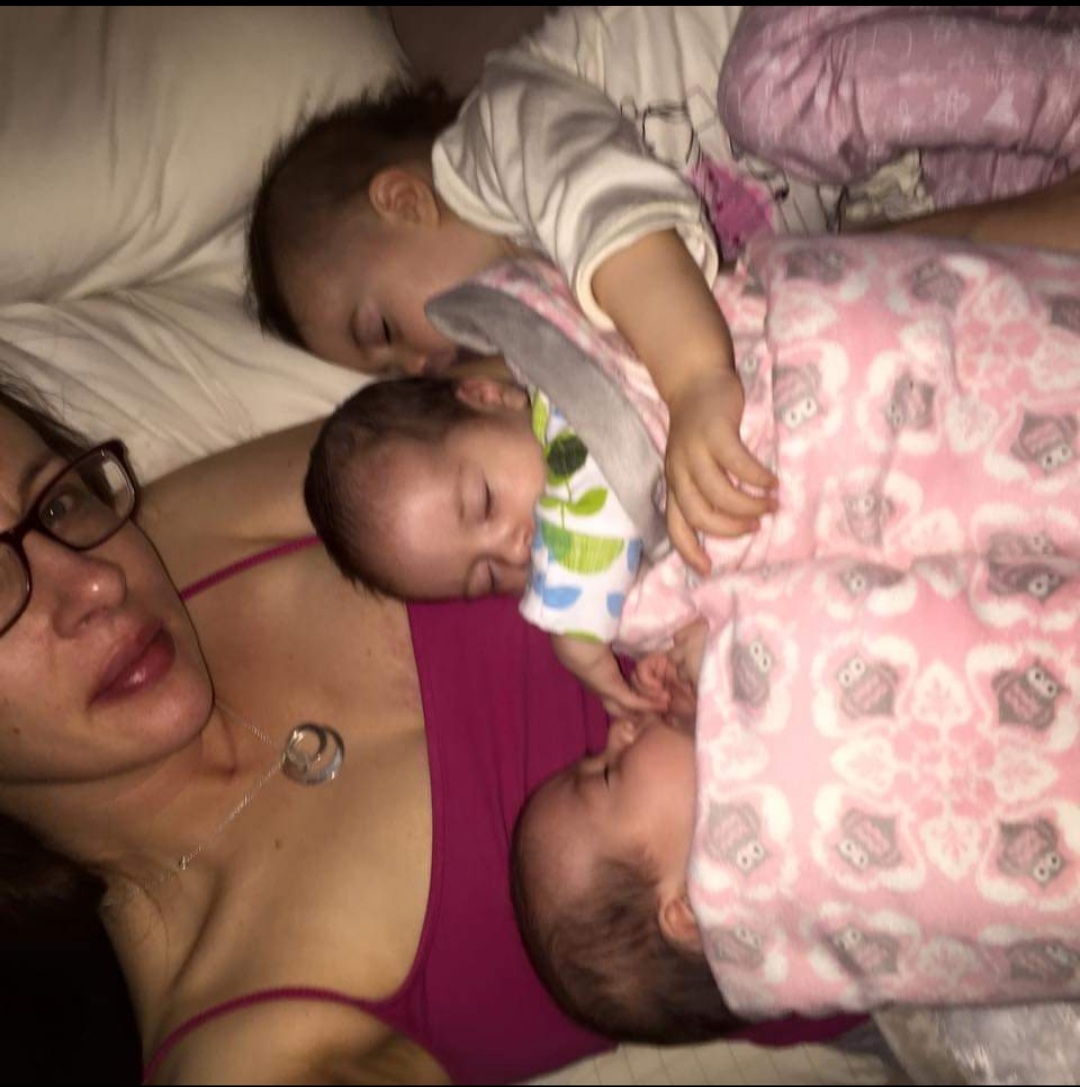 Image shows Helen holding her three daughters.