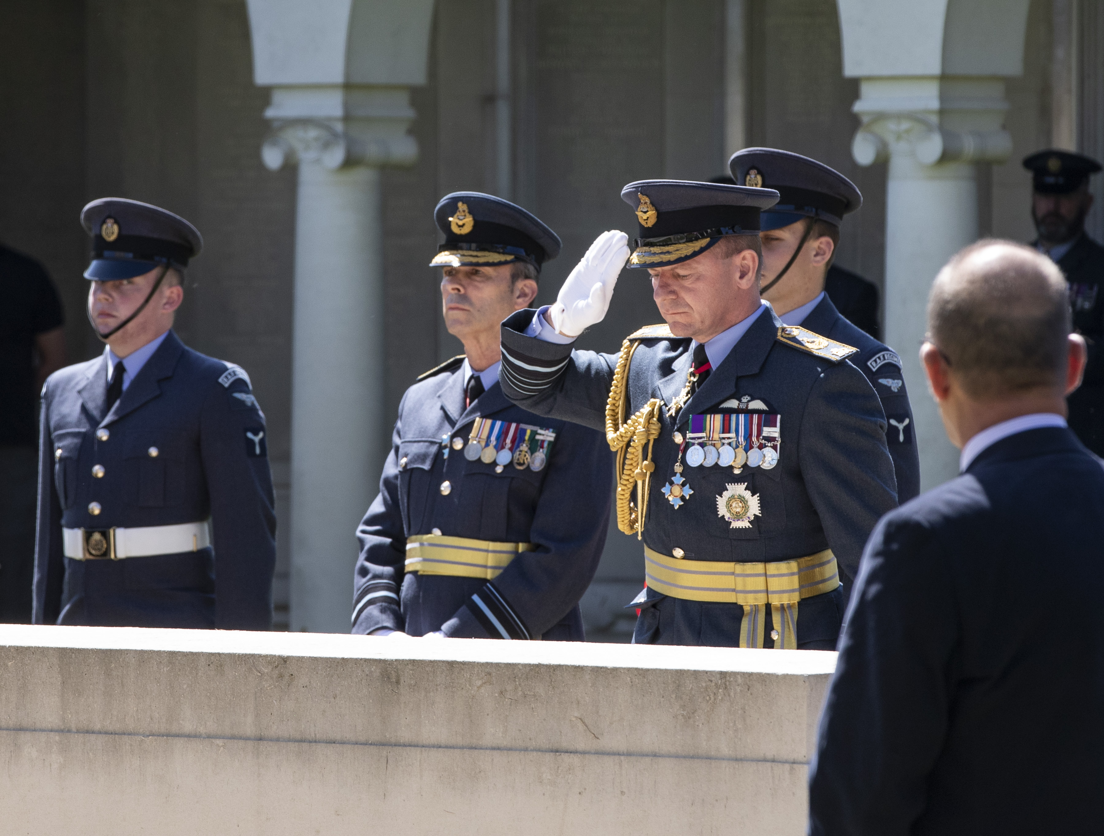 Chief of the Air Staff salutes by memorial.