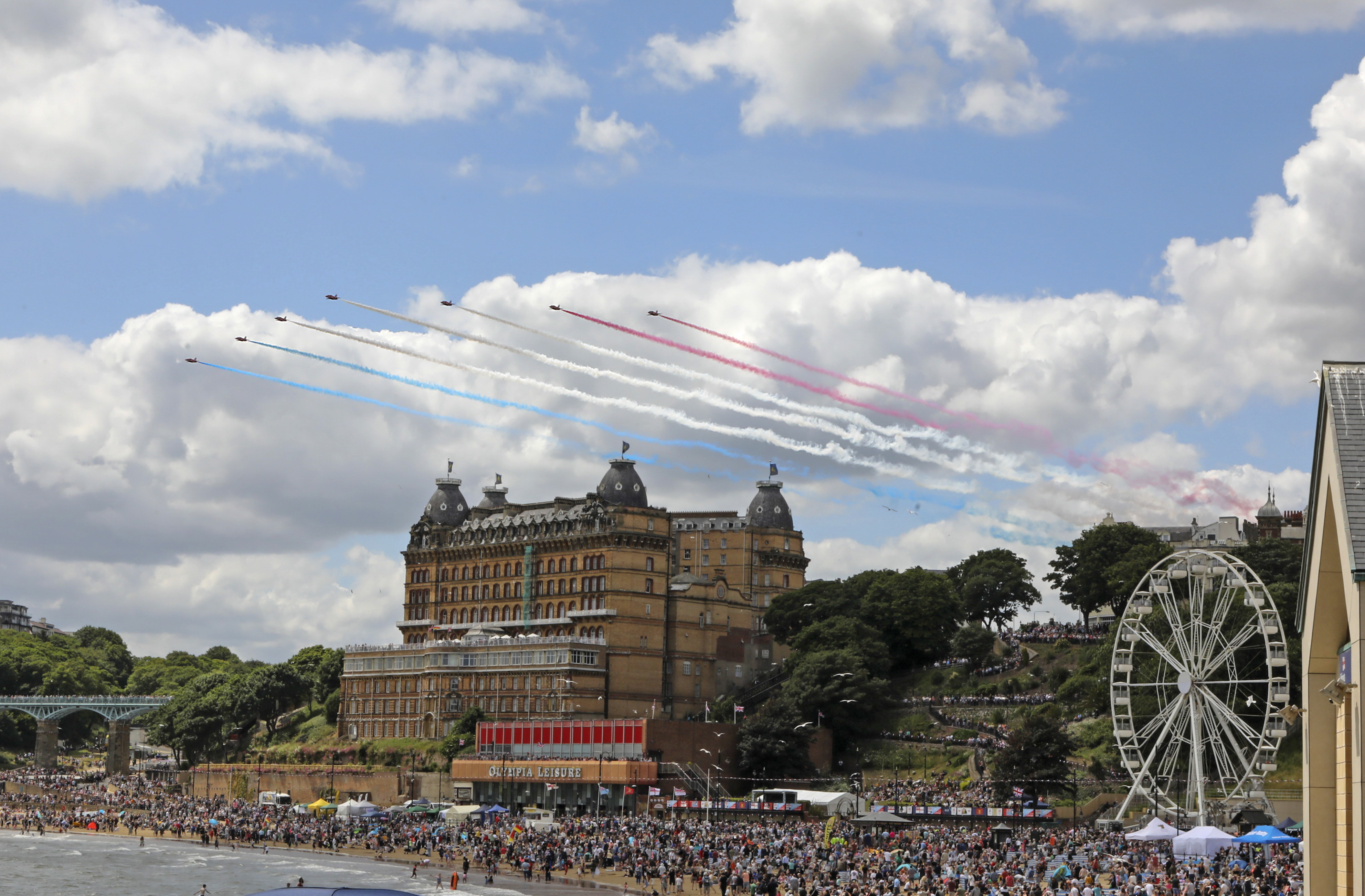 Thousands of people watch the Red Arrows perform in Scarborough for Armed Forces' Day. 