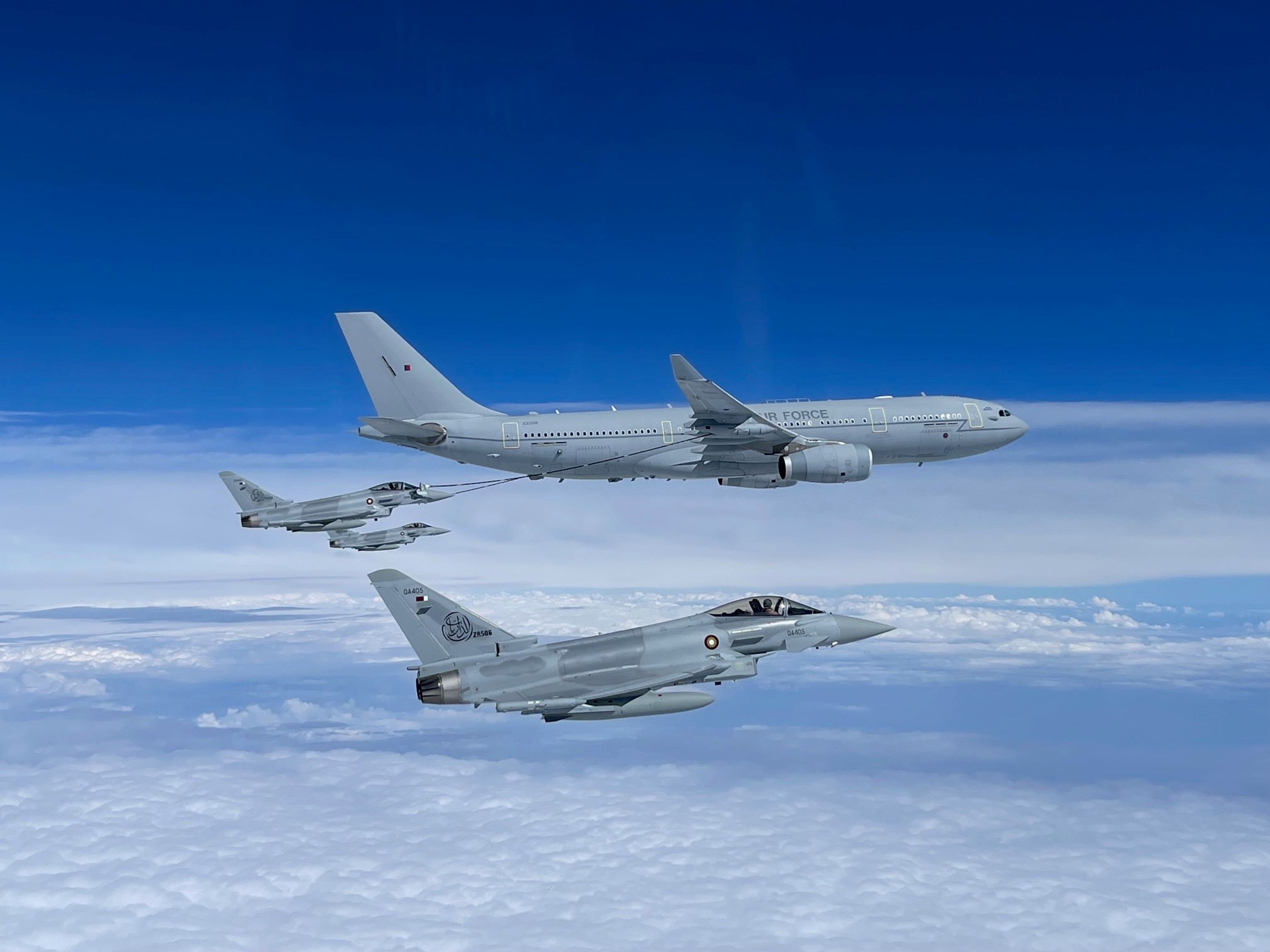  Image shows RAF Voyager and Typhoons during air-to-air refuelling exercise.