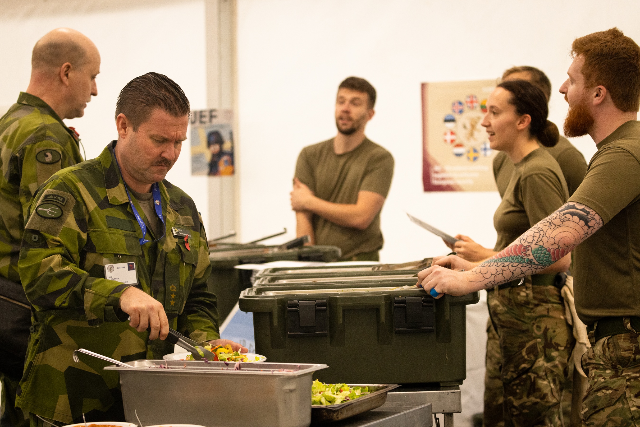 Image shows personnel in a catering hall.