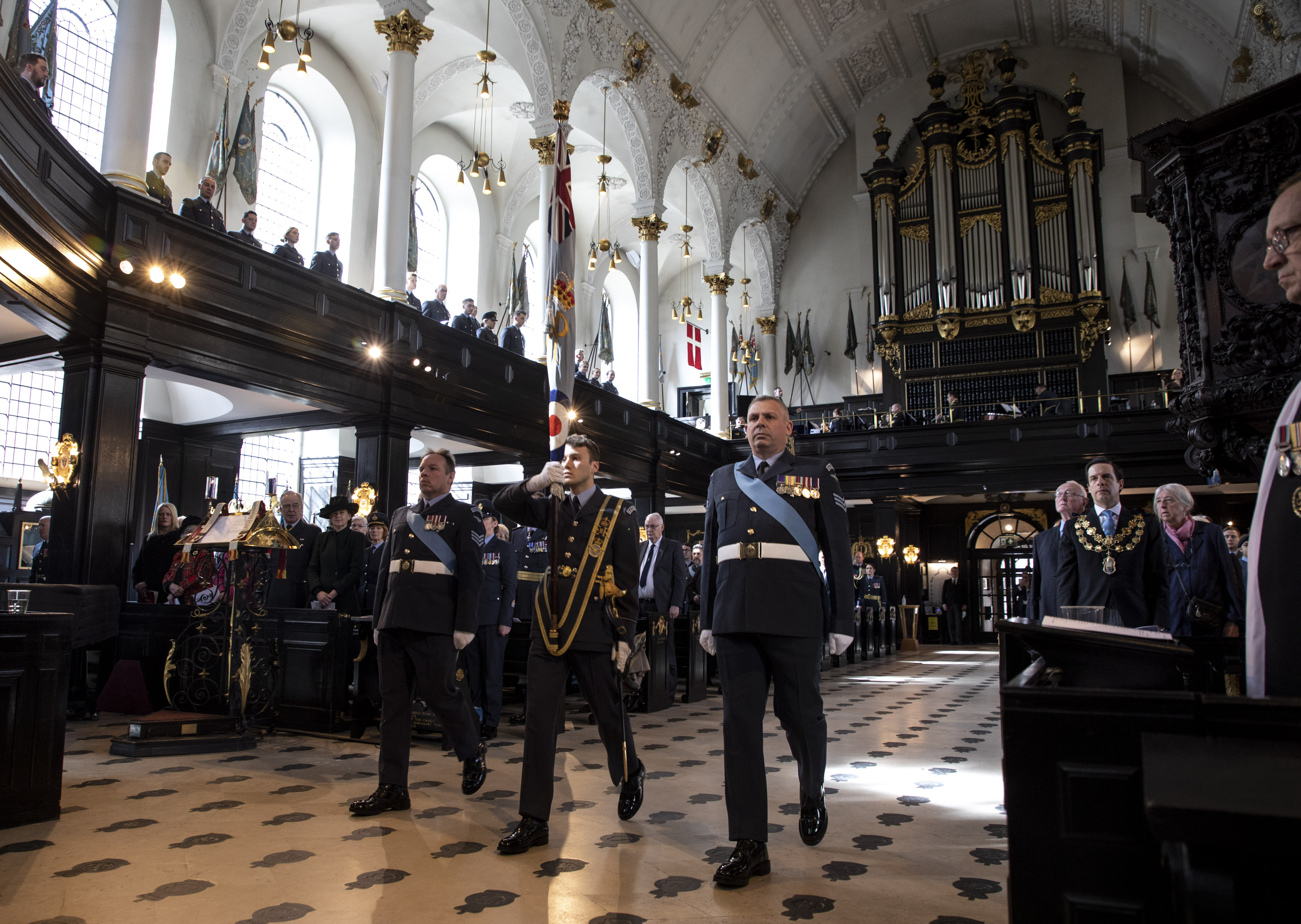 Personnel inside the church perform the service.