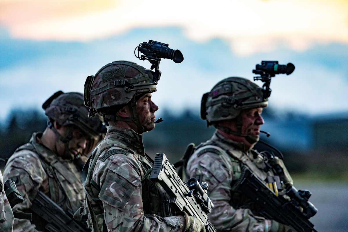 Image shows RAF Regiment with rifles and head cameras.