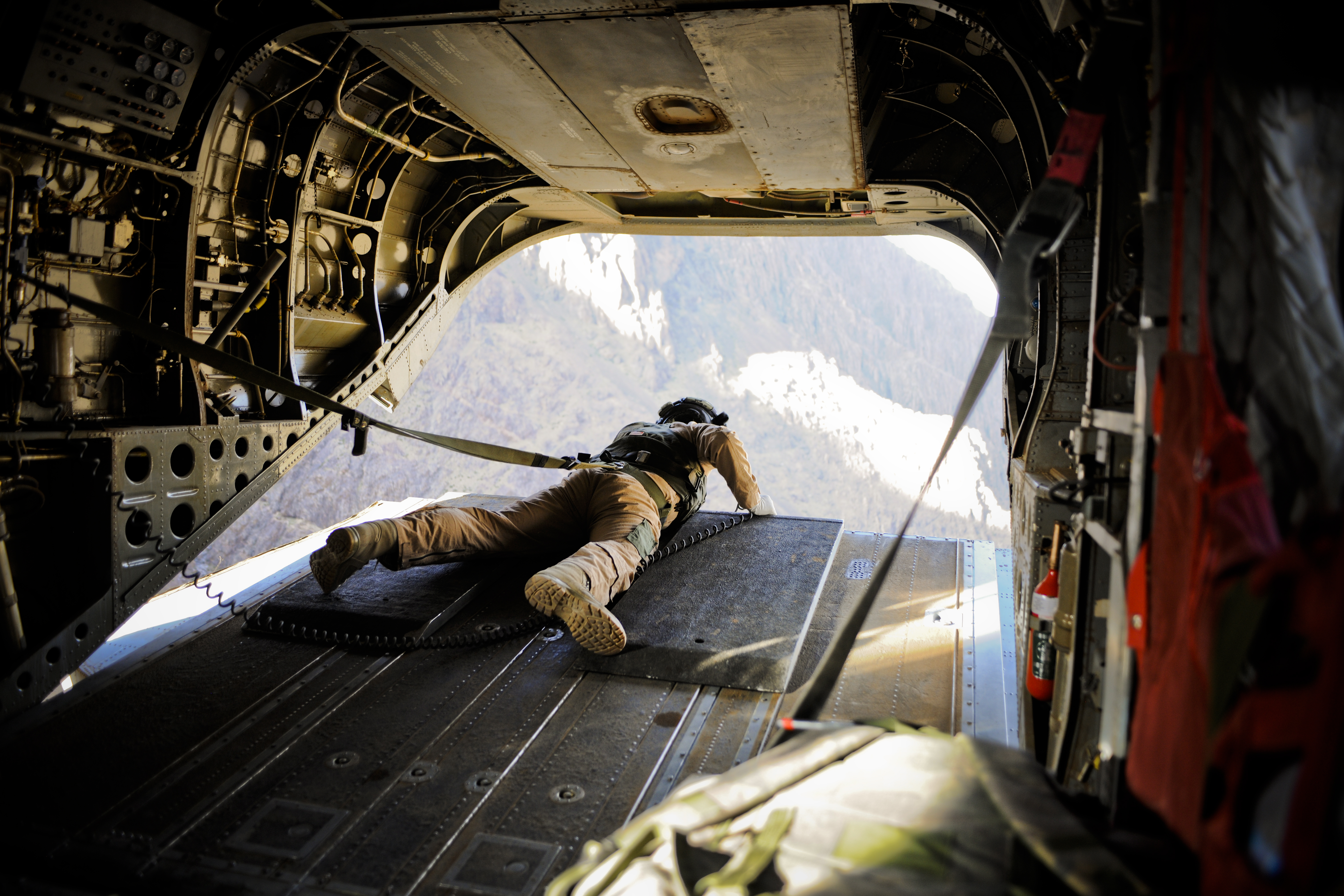 RAF Regiment Gunner in prone at the back of aircraft.