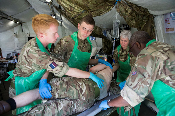 RAF Medics work with patient. 