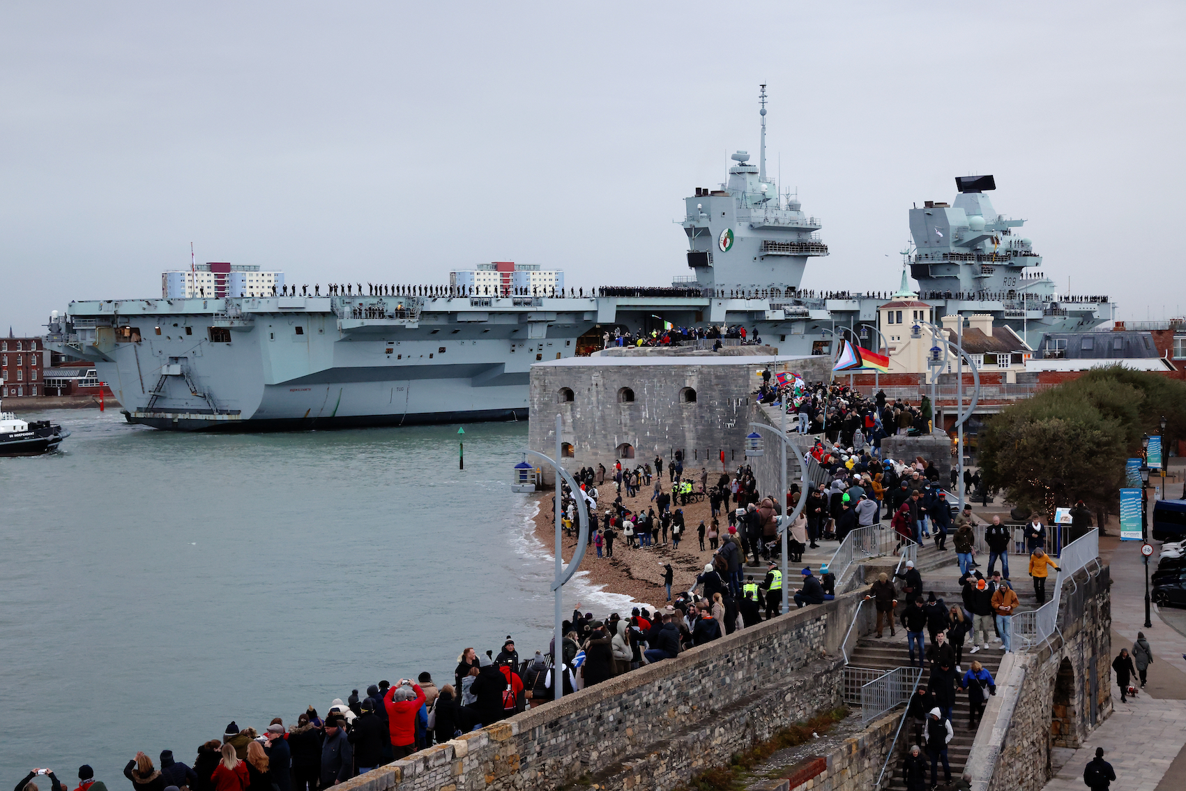 Public gather at the harbour, as HMS Queen Elizabeth returns home.