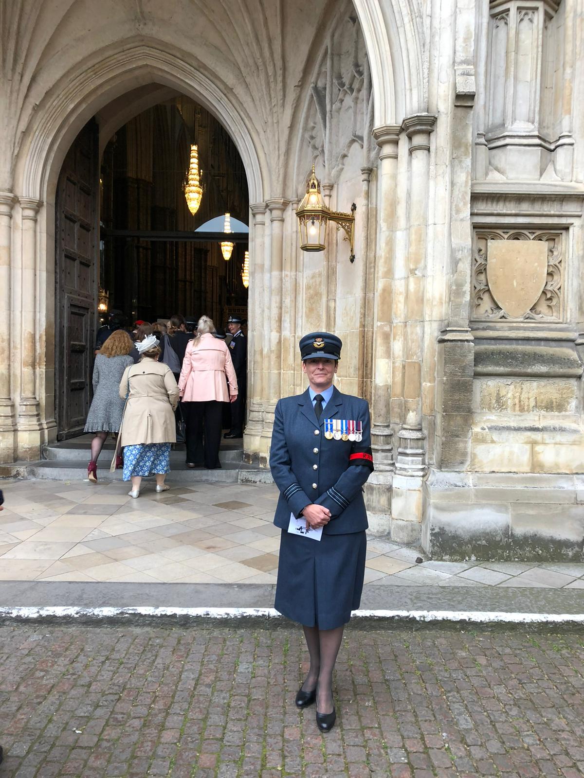 Image shows RAF aviator standing outside a cathedral.