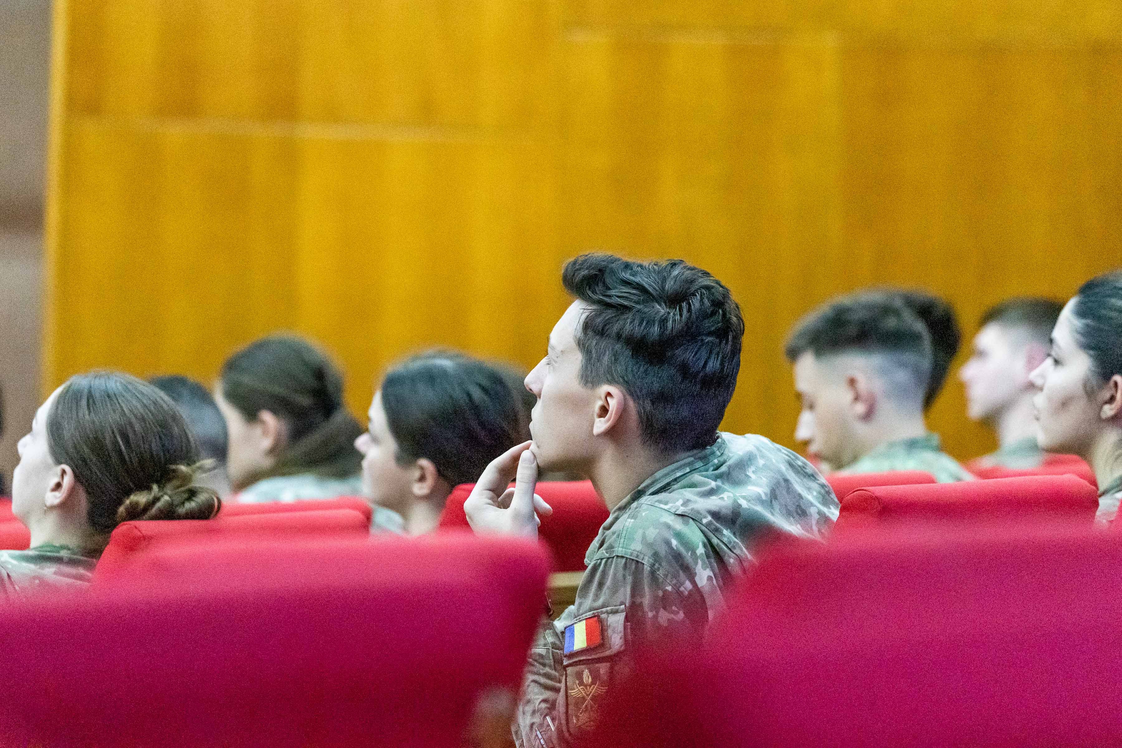 Personnel in the audience of lecture hall.