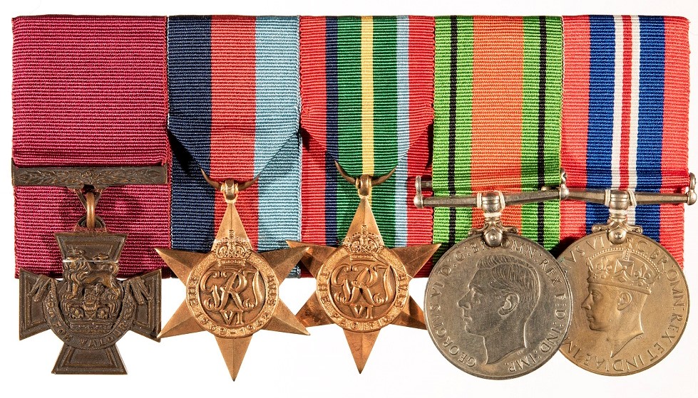 Image shows World War Two medals on a breastplate.