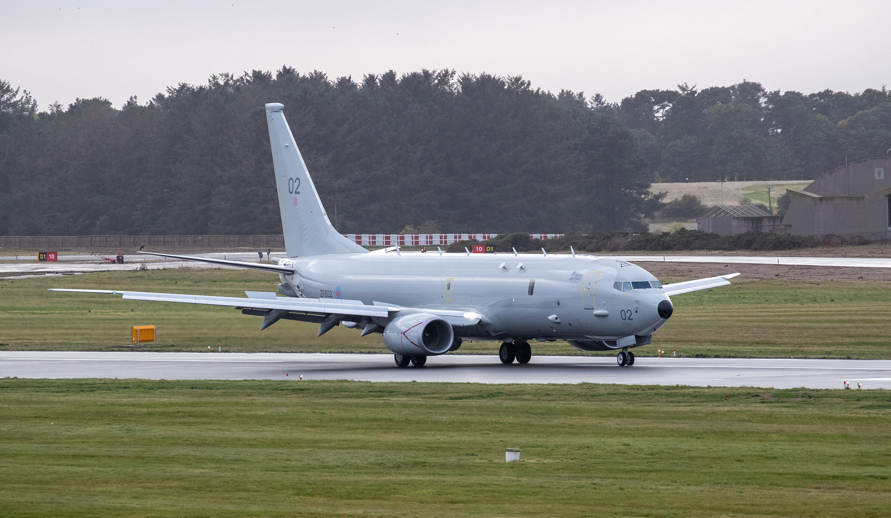 Image shows a RAF Poseidon aircraft on the airfield.