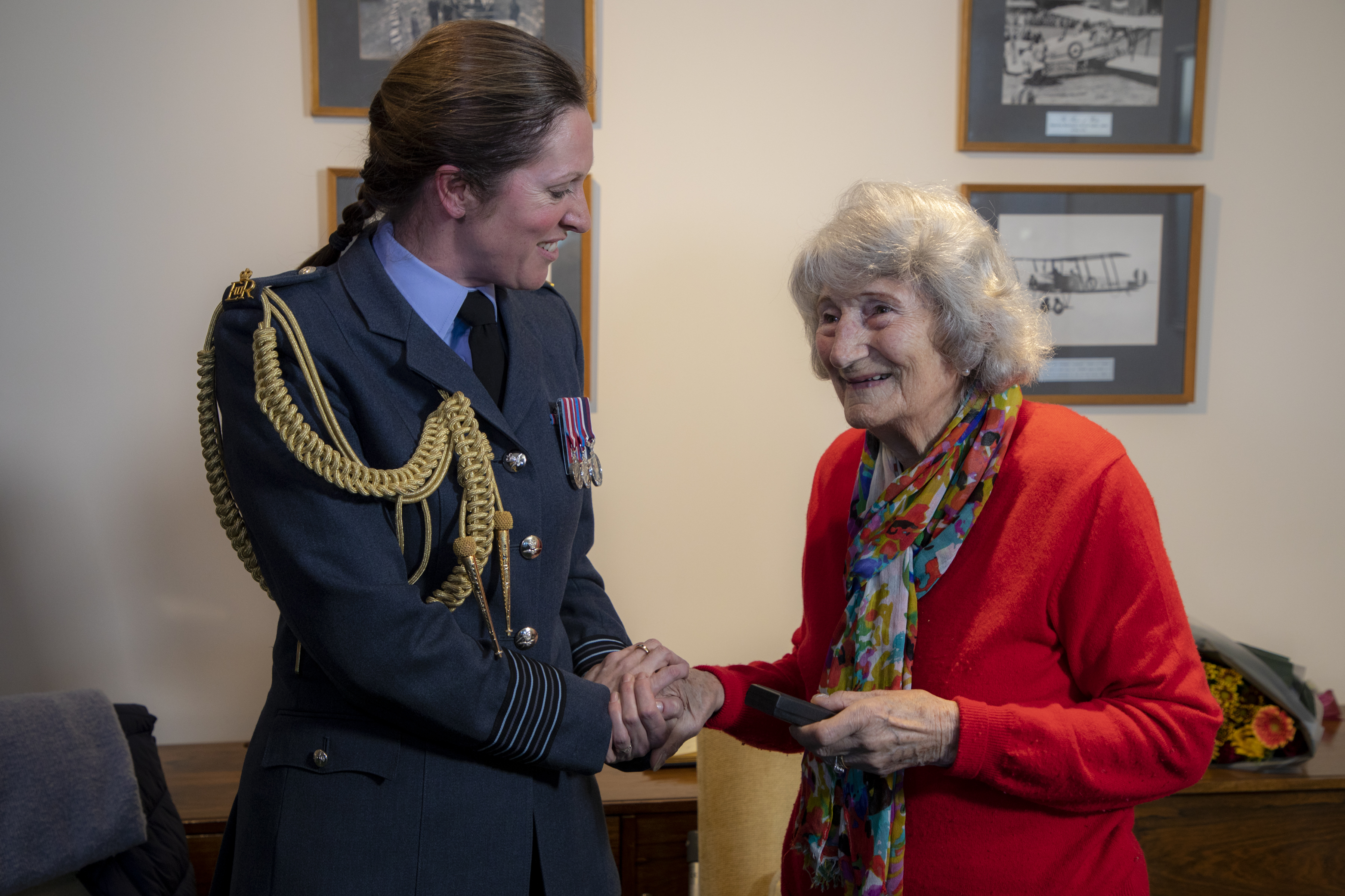 Image shows Veteran shaking hands with RAF aviator.