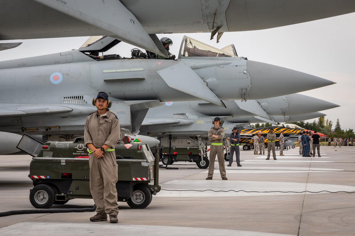Image shows RAF aviator standing by Typhoons on the airfield.