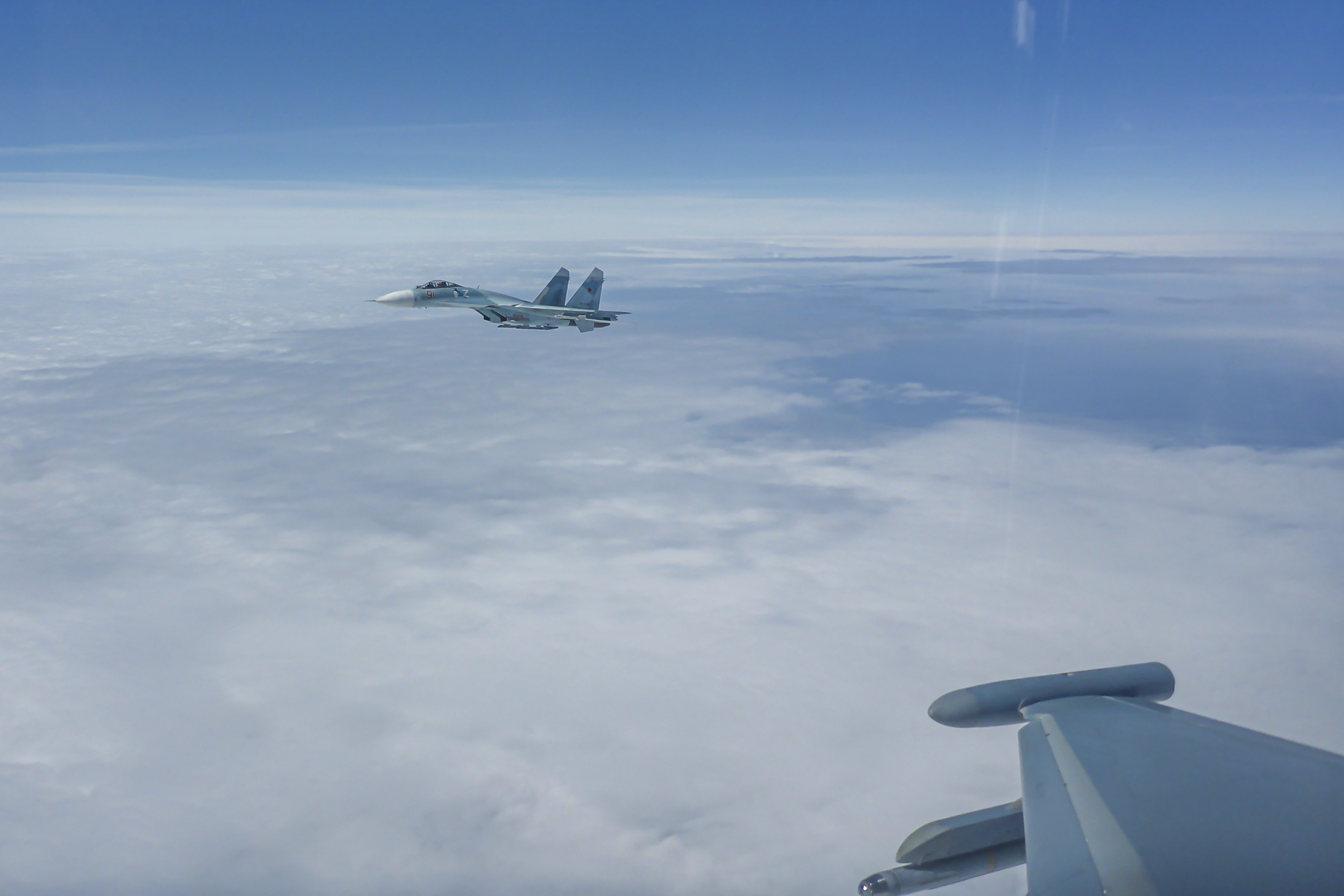 Image shows RAF Typhoon in flight alongside German Air Force fighter jet.