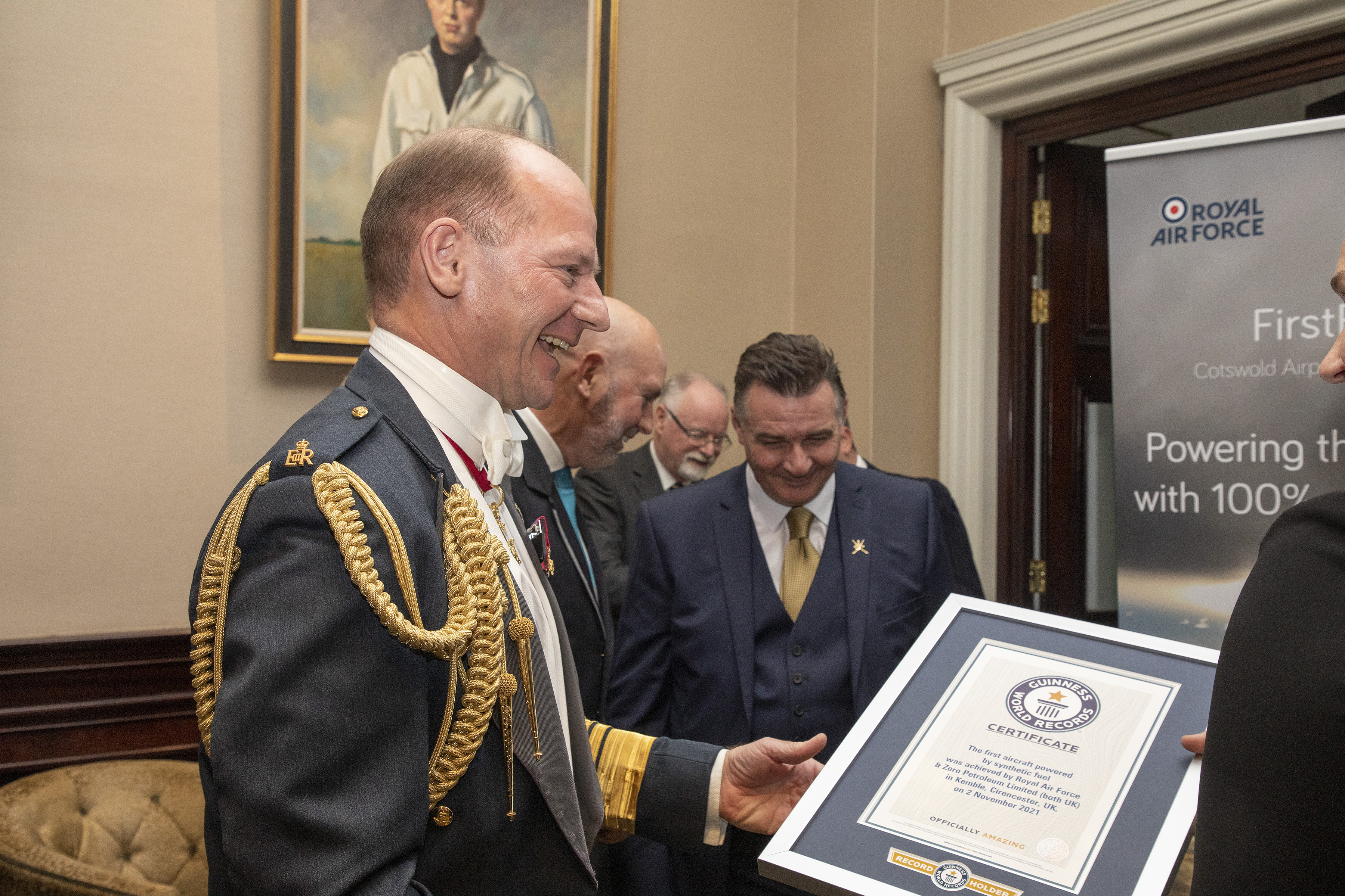 Air Chief Marshal Sir Mike Wigston holds the Guinness Book of Records Award.