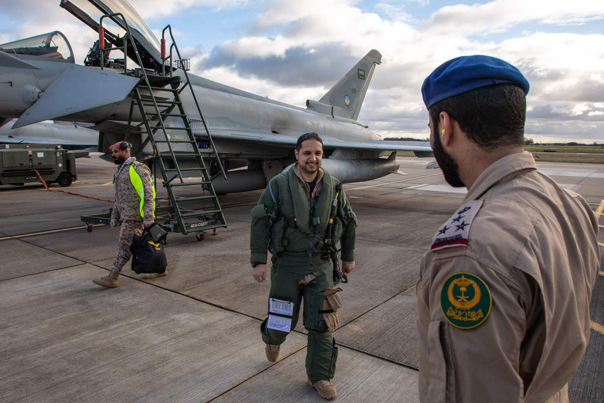 Image shows Joint RAF Qatari personnel with Typhoons on the airfield.