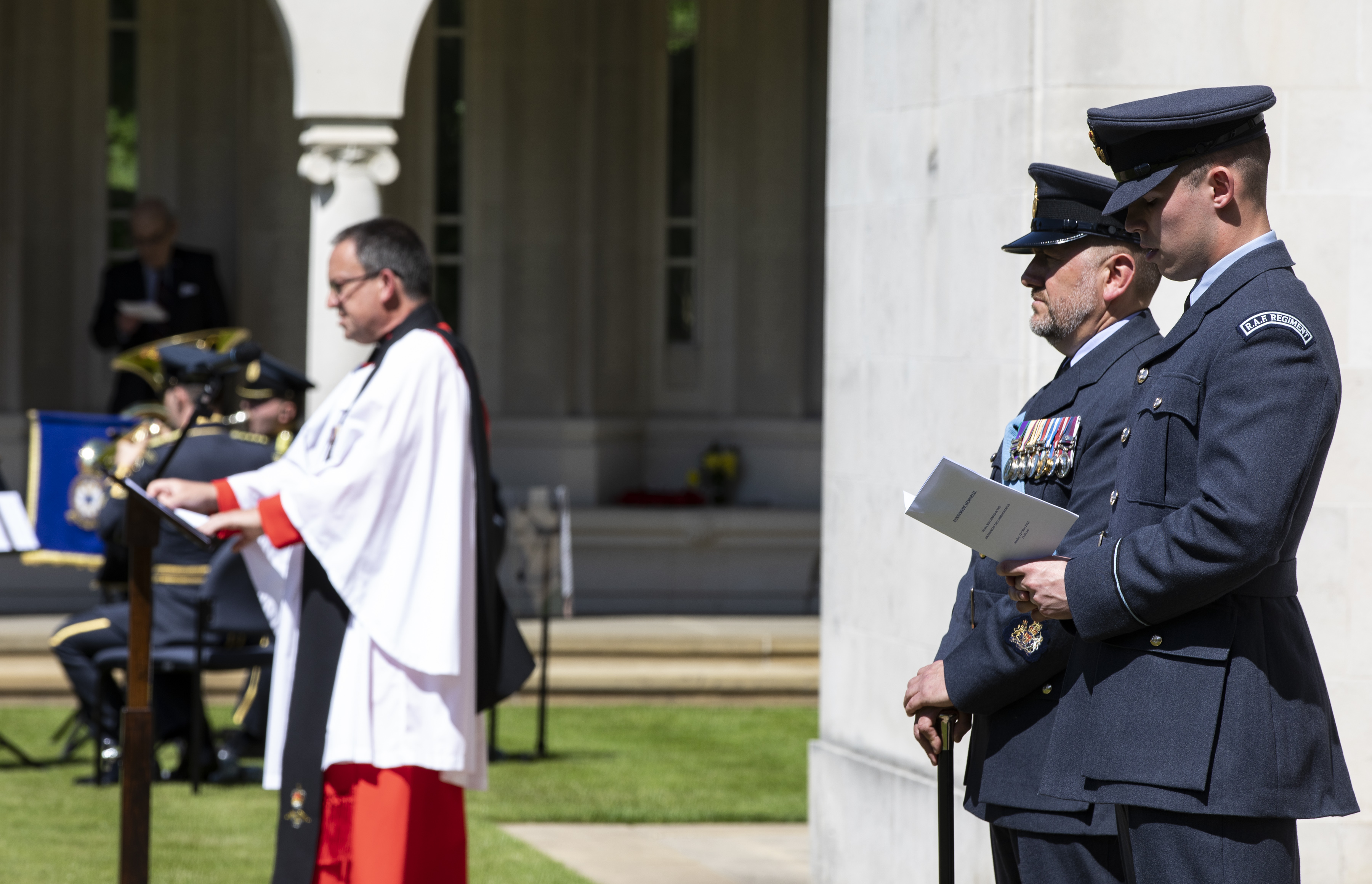 Personnel and chaplain by memorial.