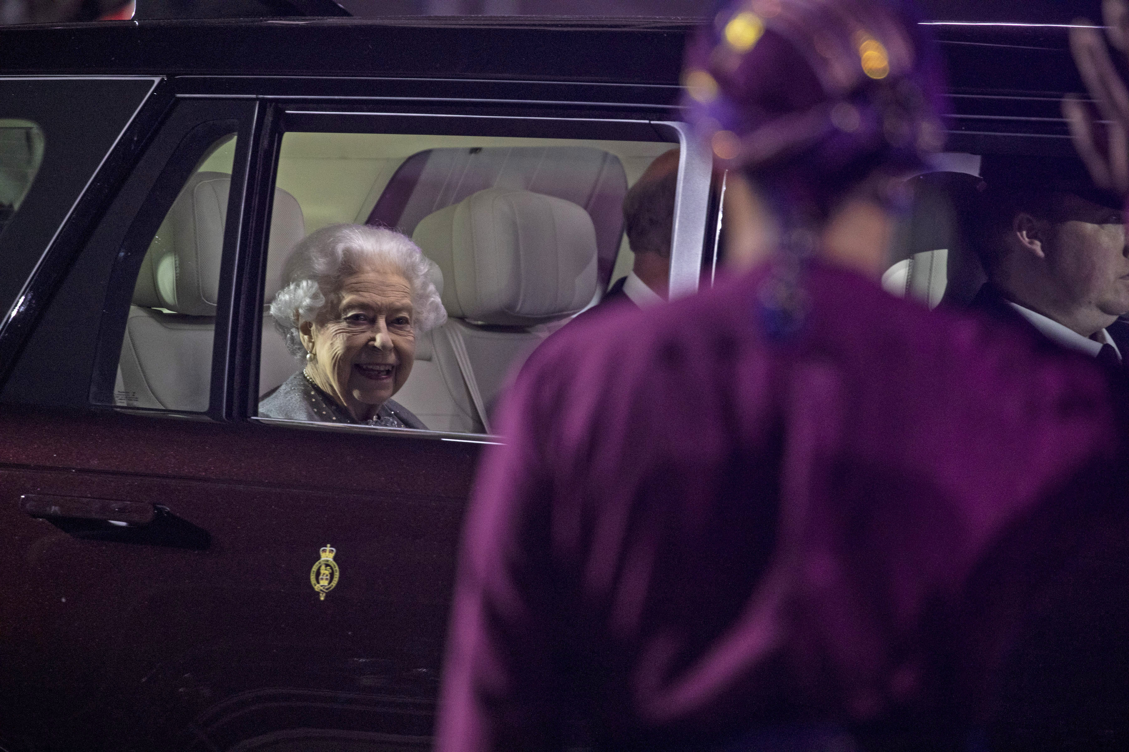 The Queen in a Royal car.