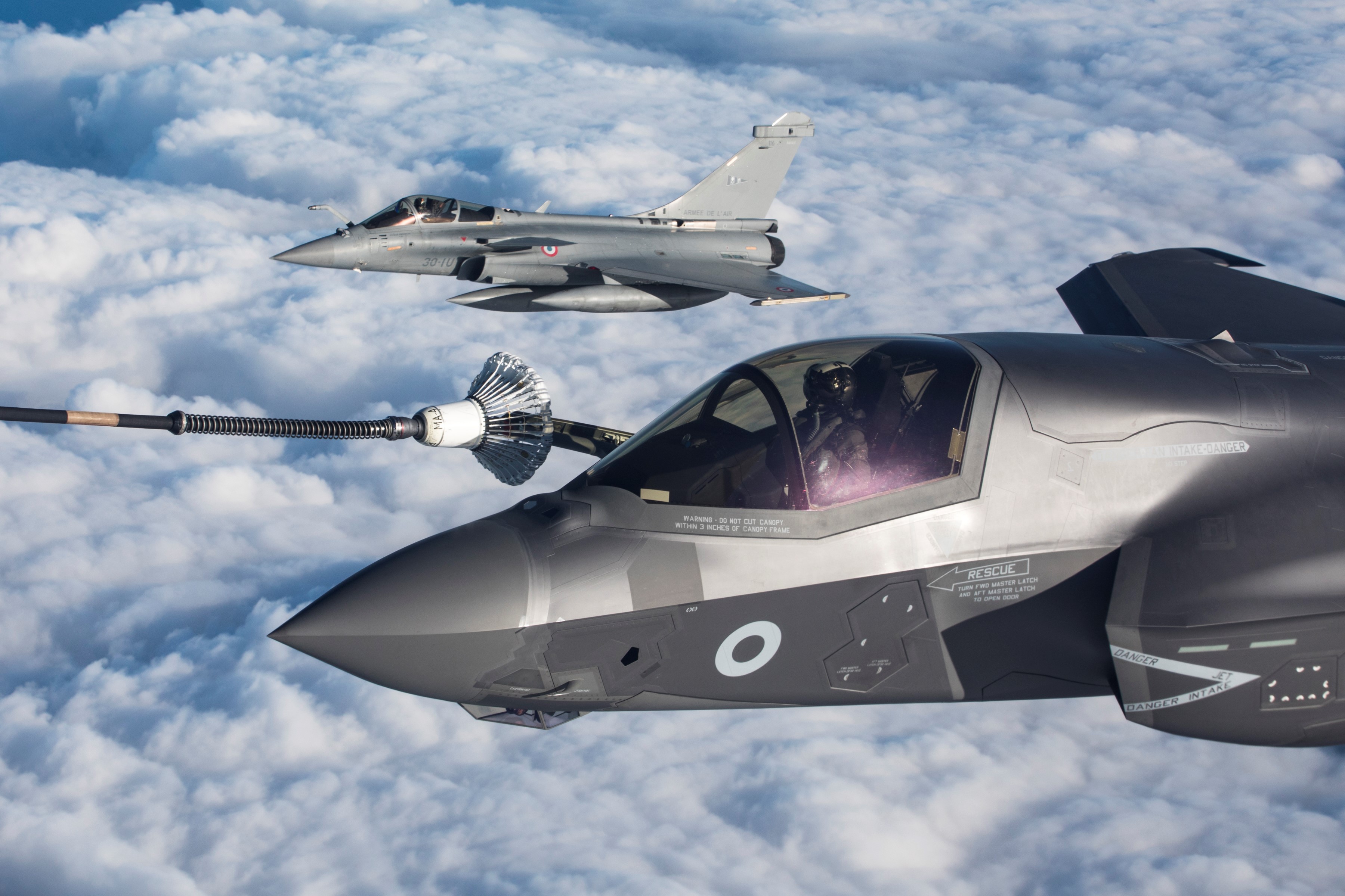 Two Lightning aircraft during air-to-air refuelling.