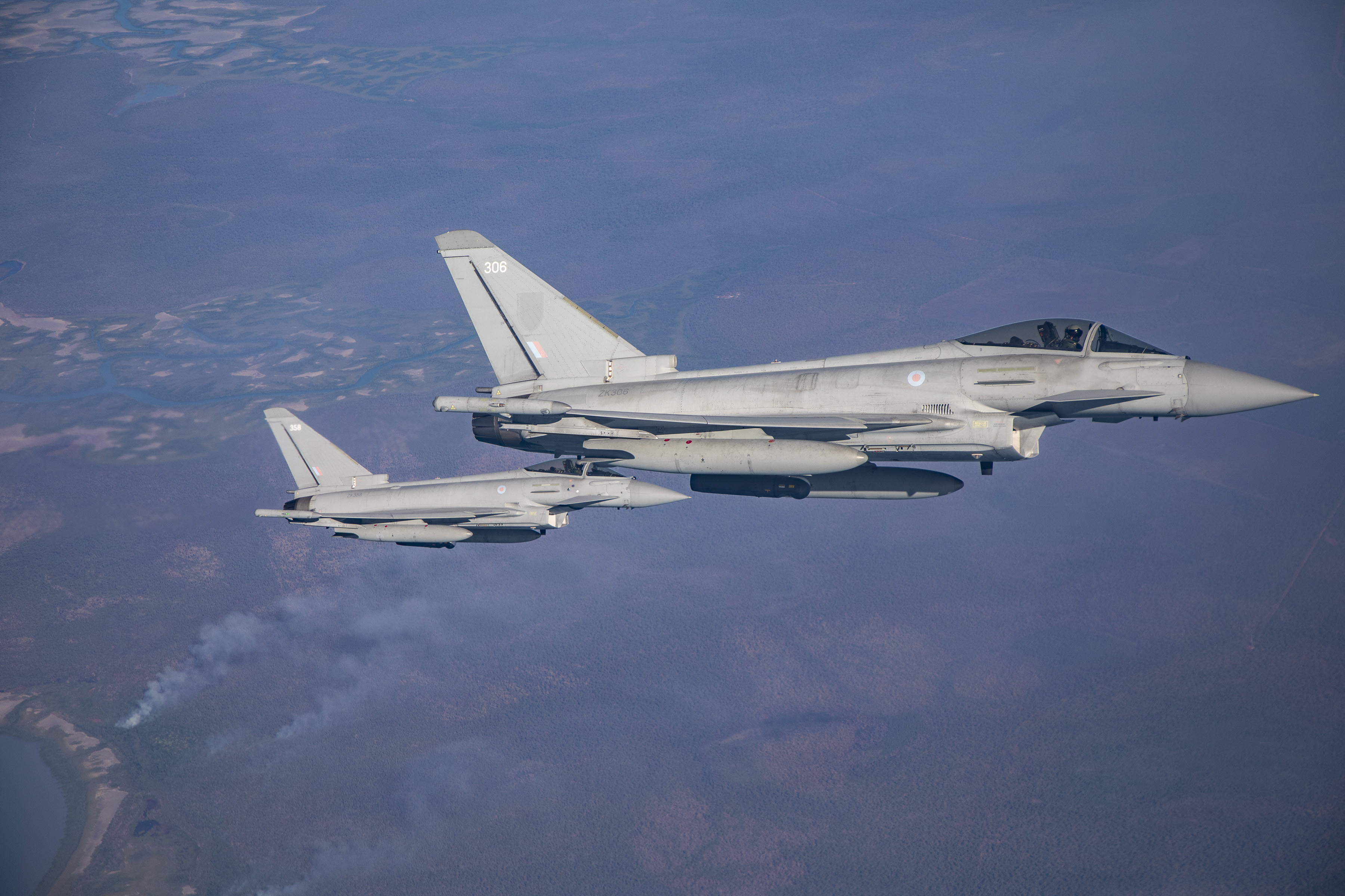 Image shows two RAF Typhoons in flight.
