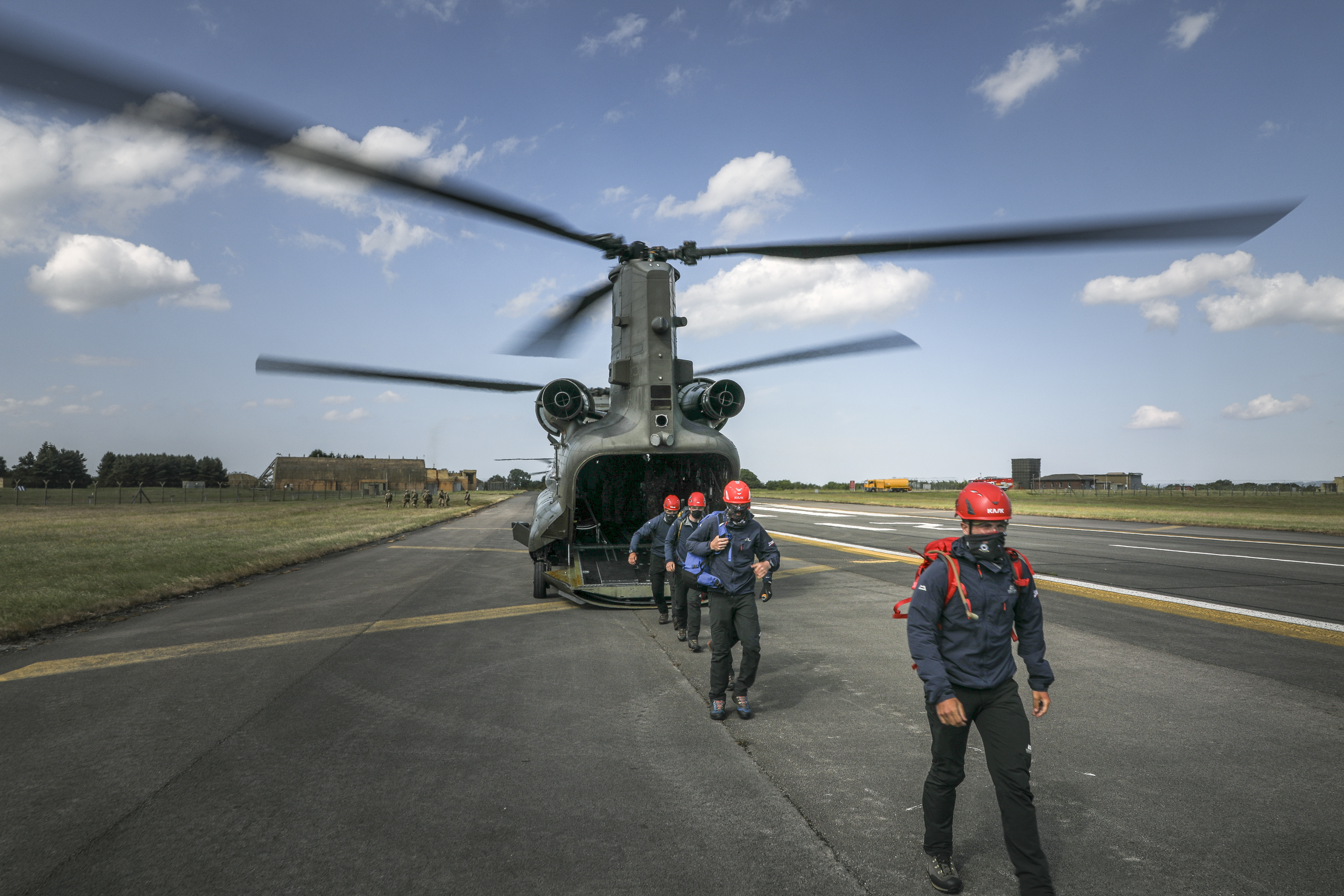 Mountain Rescue Service personnel disembarking from a chinook