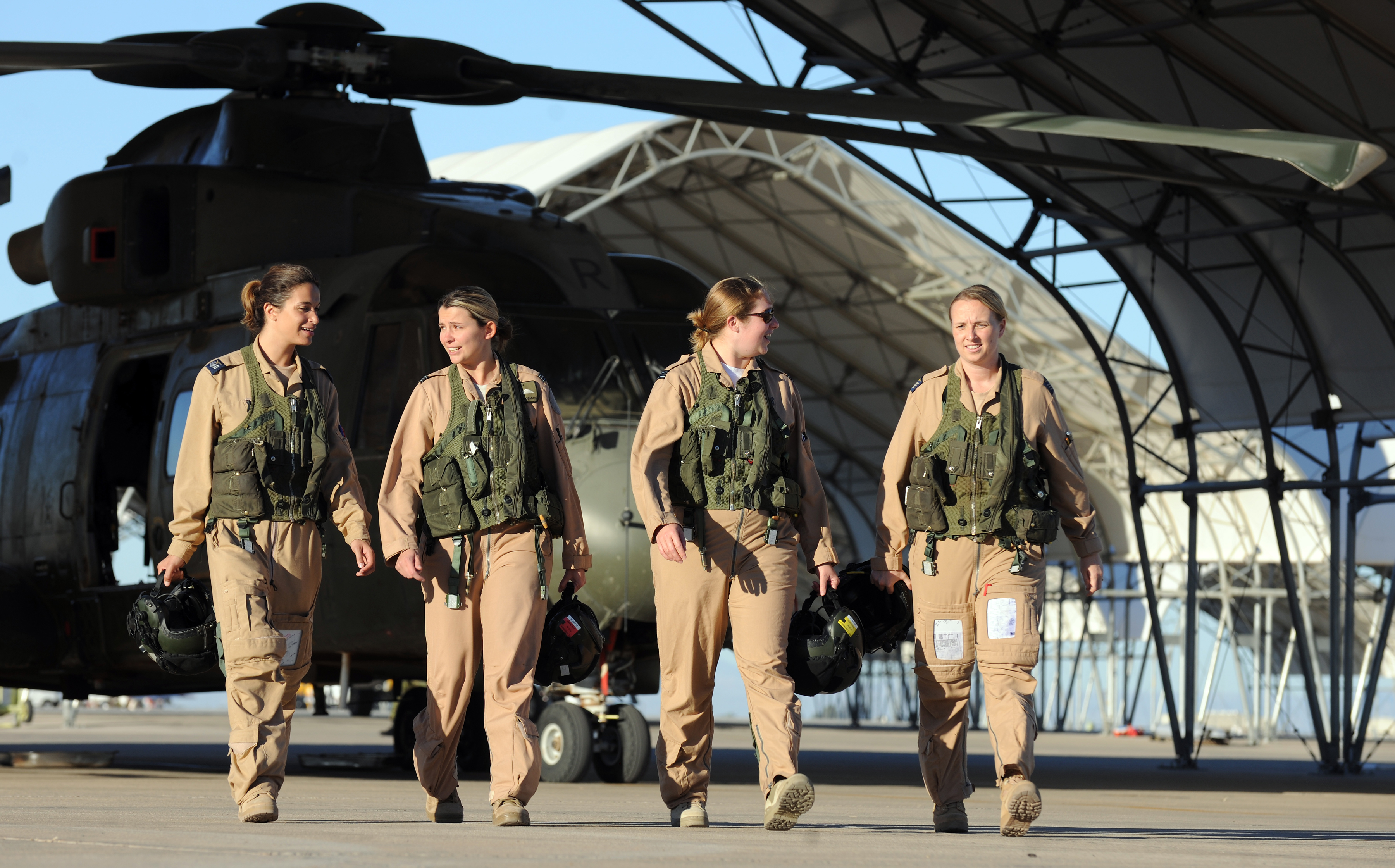 Image shows RAF Women Pilots walking in a line on airfield