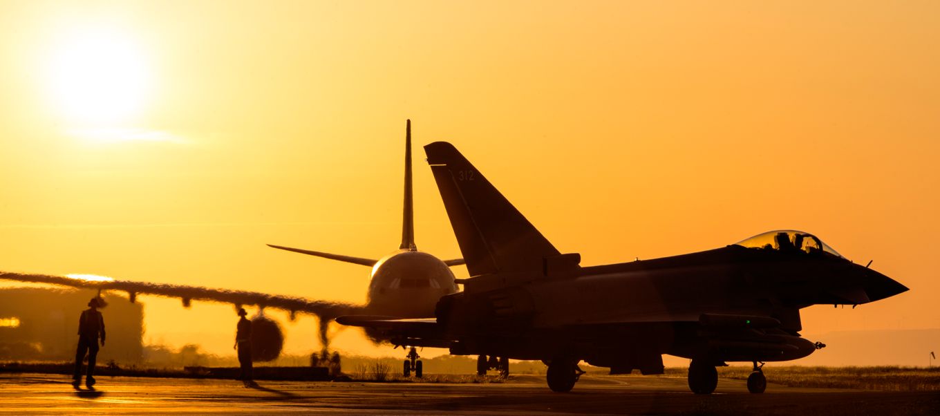 Typhoon on the airfield during sunset.