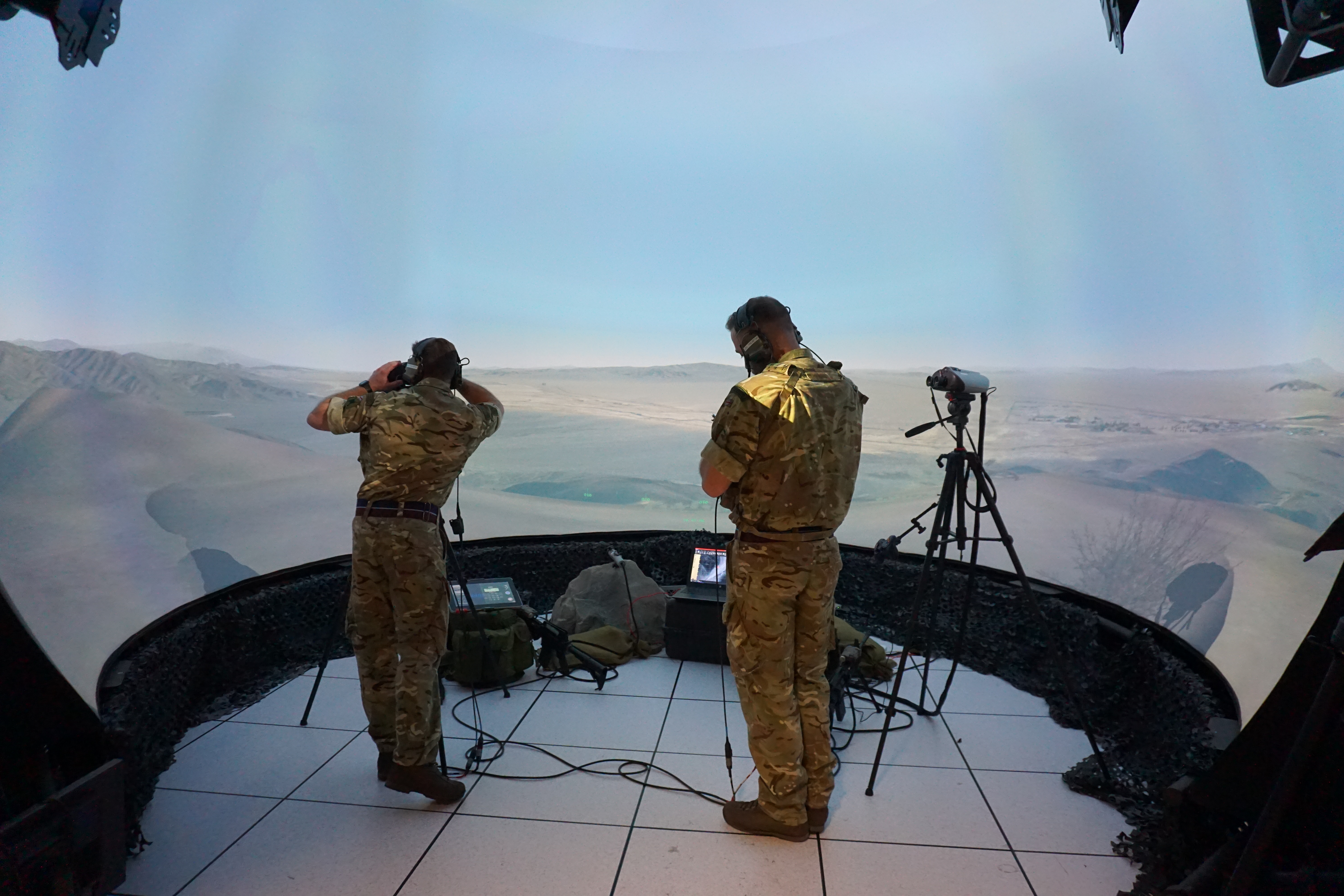 Image shows RAF aviator using binoculars equipment.