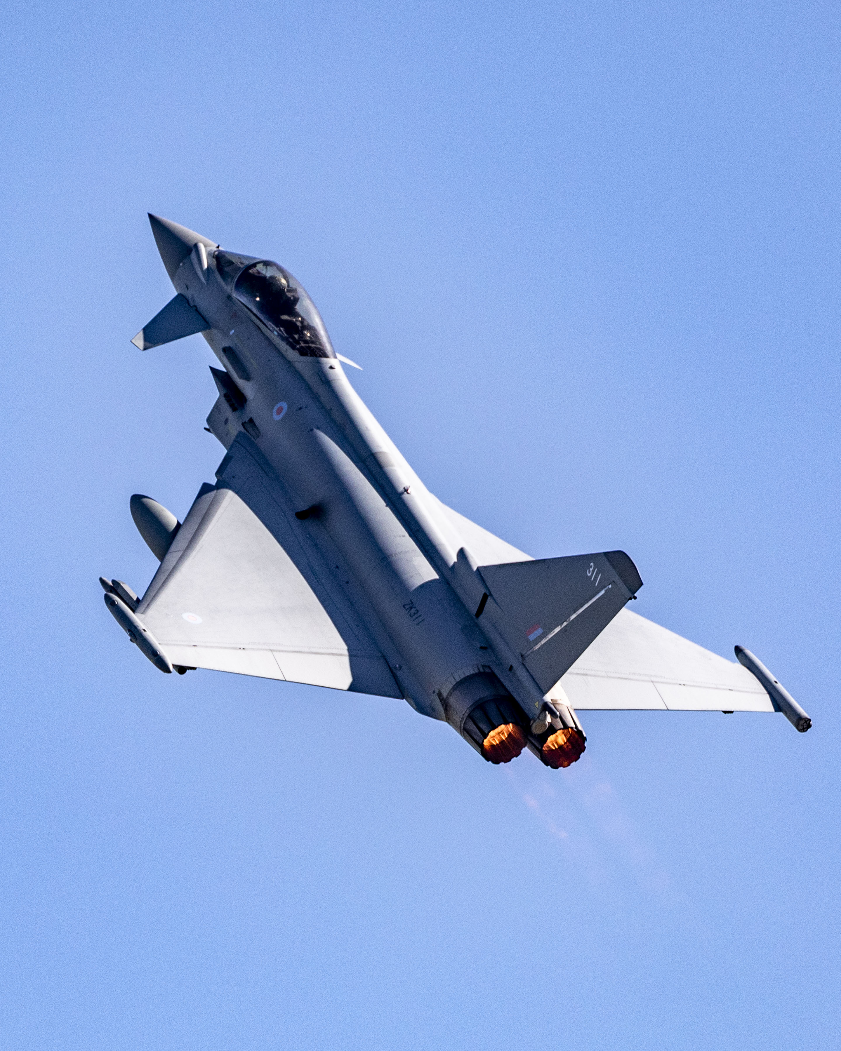 RAF Typhoon in flight pointing upwards.