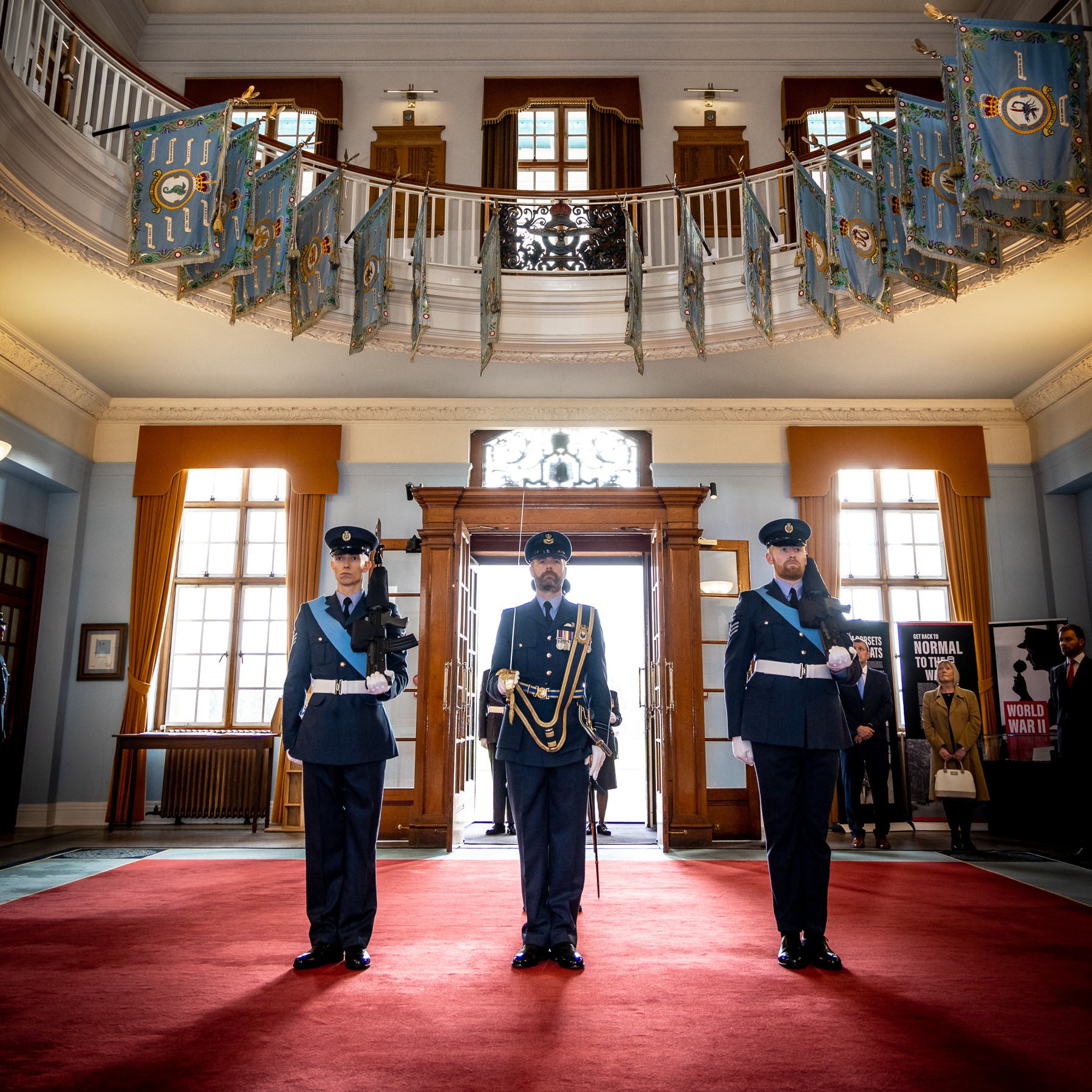 Image shows RAF aviators inside Officers' Mess during ceremony.