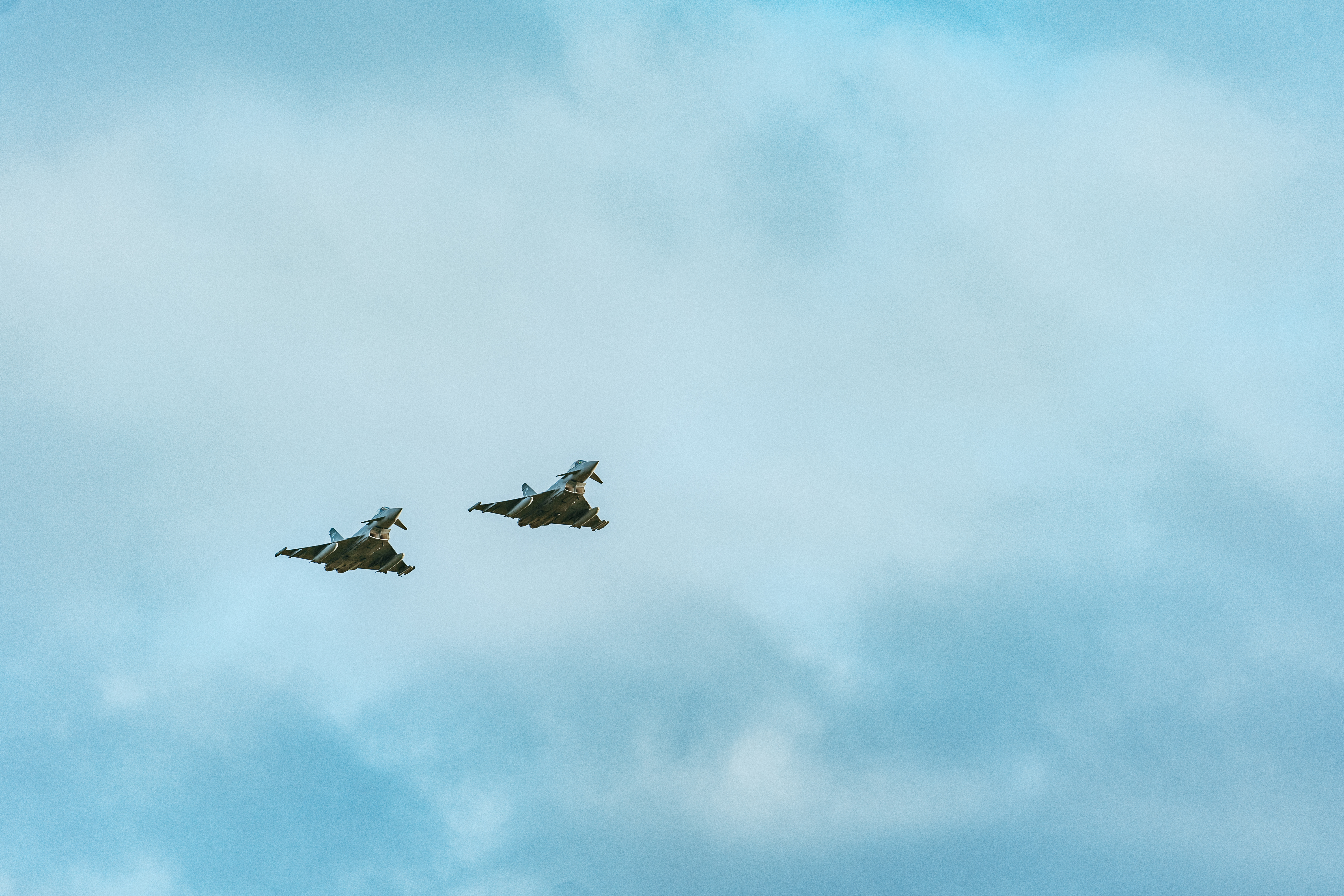 Image shows two RAF Typhoons in flight.