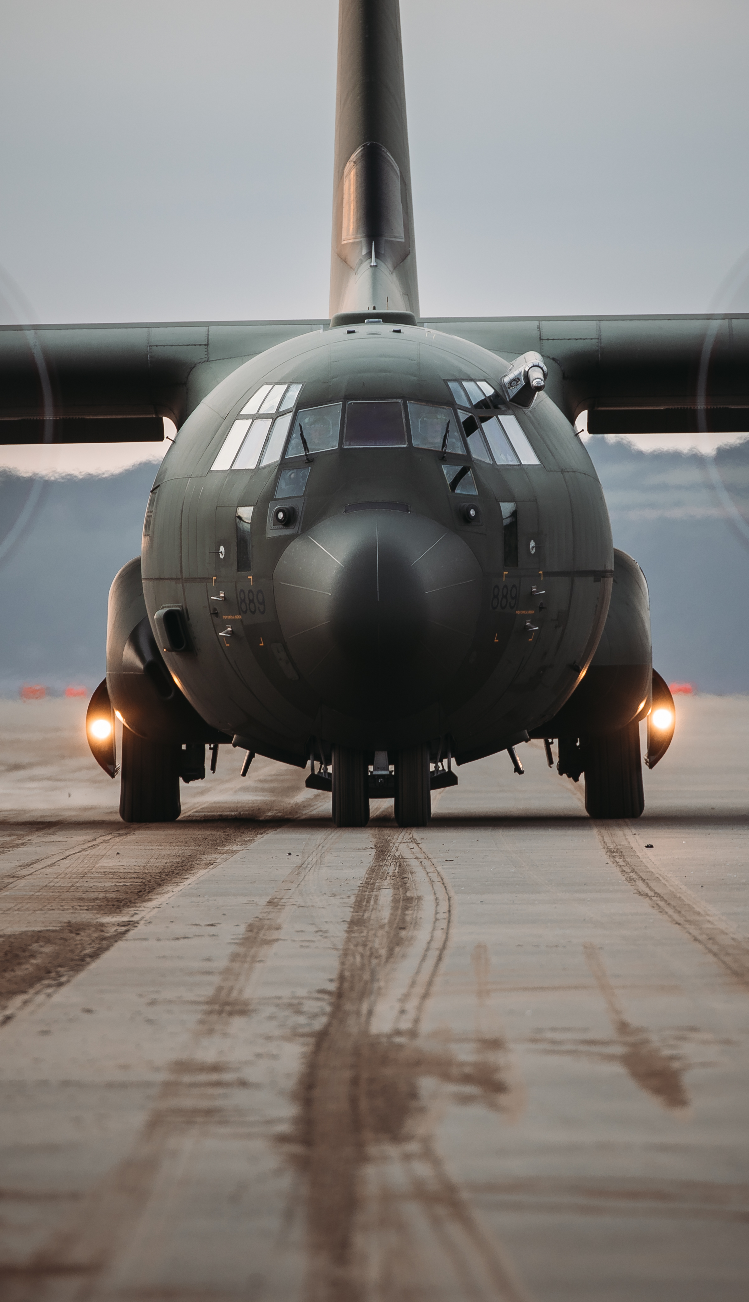Image shows close up of the front nose of the ercules aircraft on the beach.