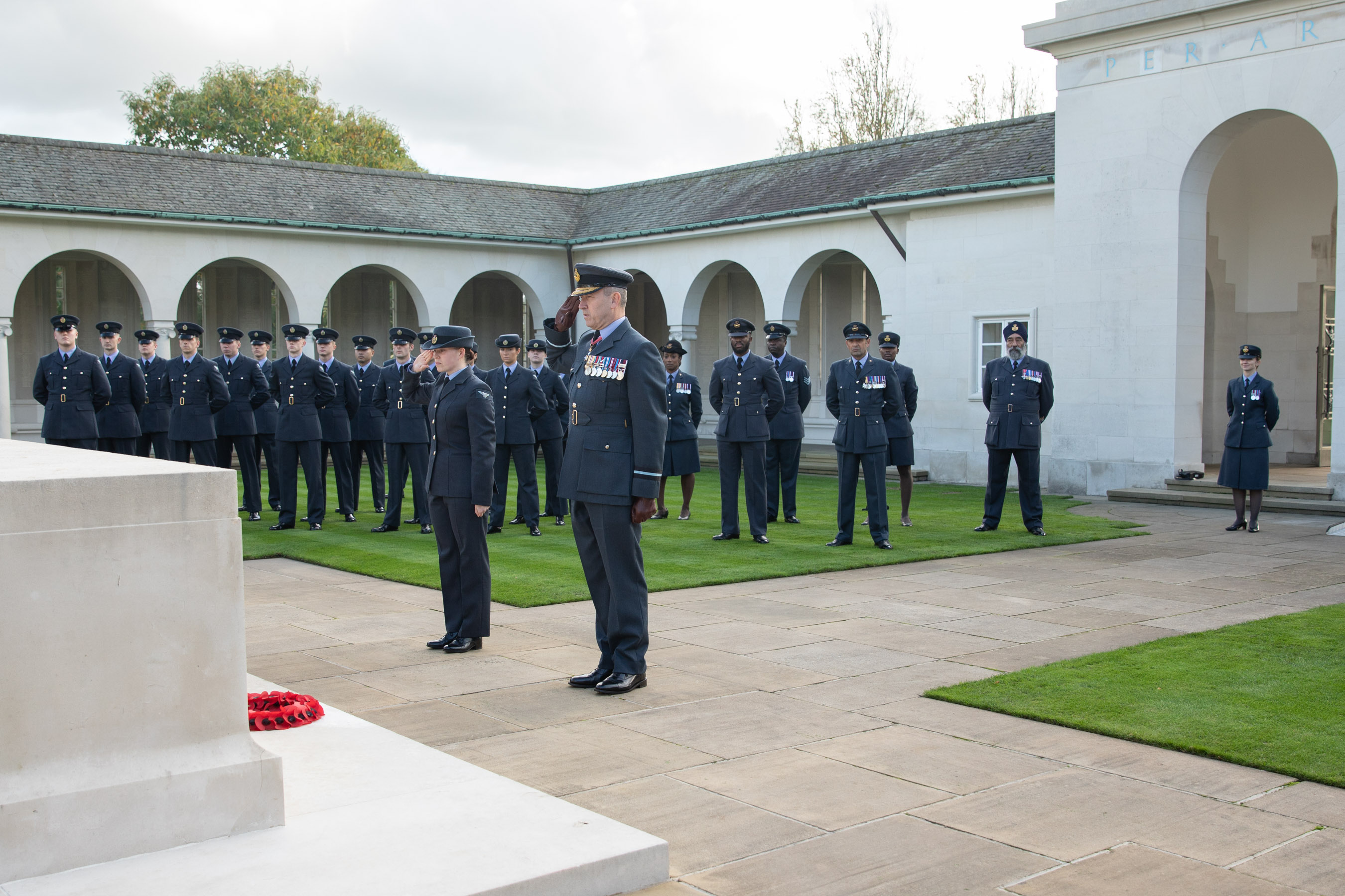 Image shows personnel at Runnymede memorial.