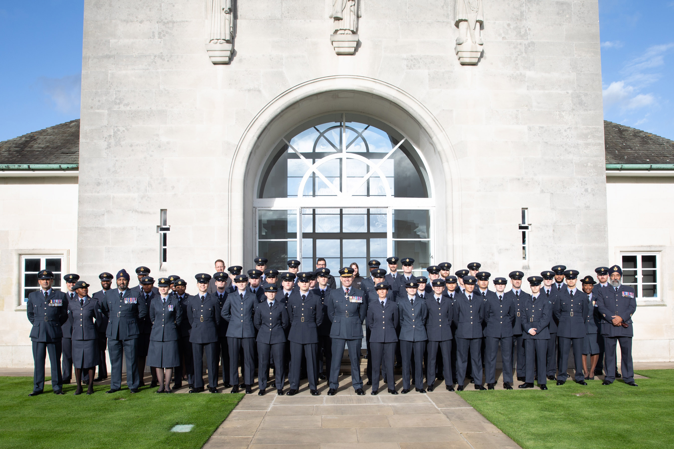Image shows personnel at Runnymede memorial.
