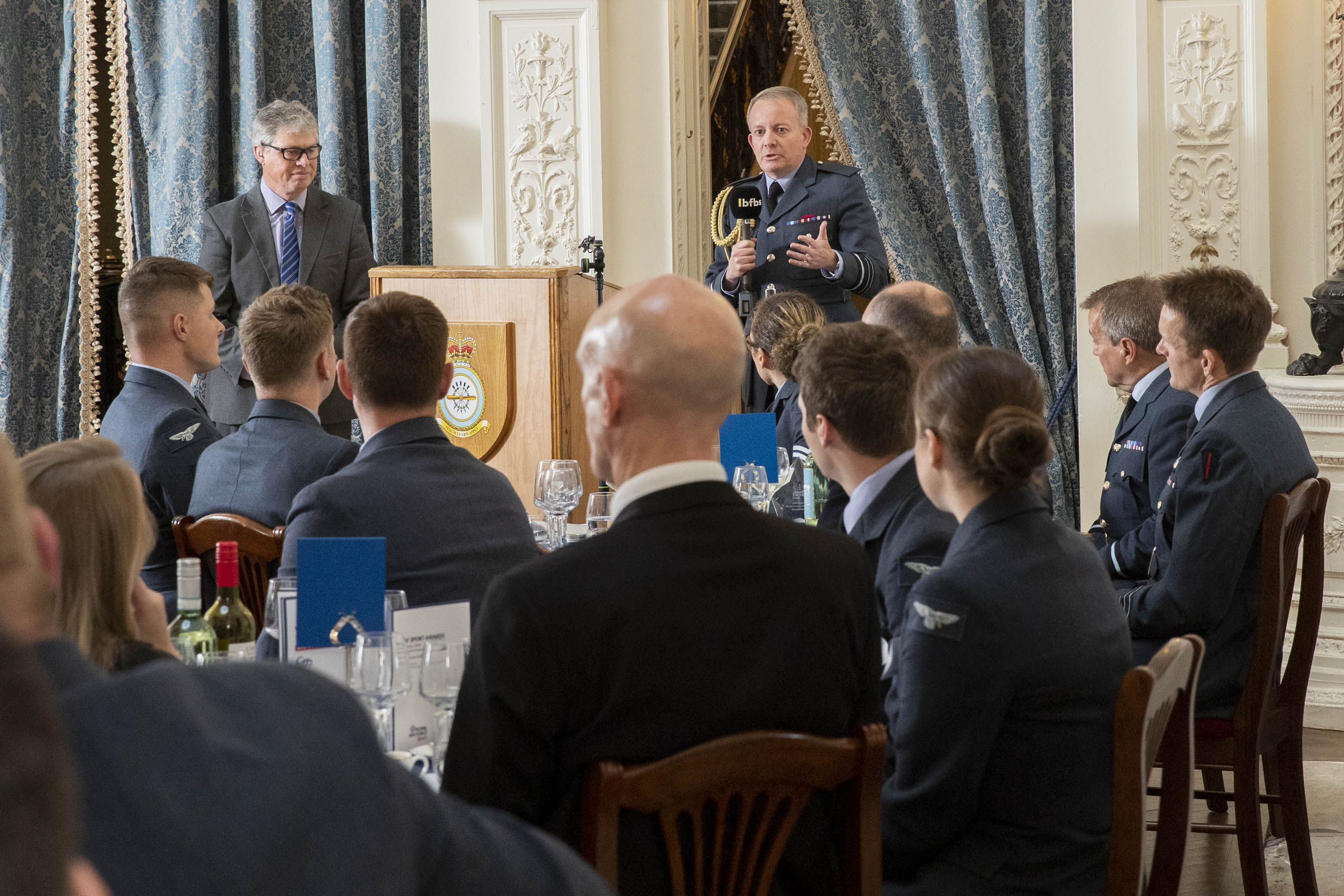 Image shows RAF personnel at tables in Halton House.