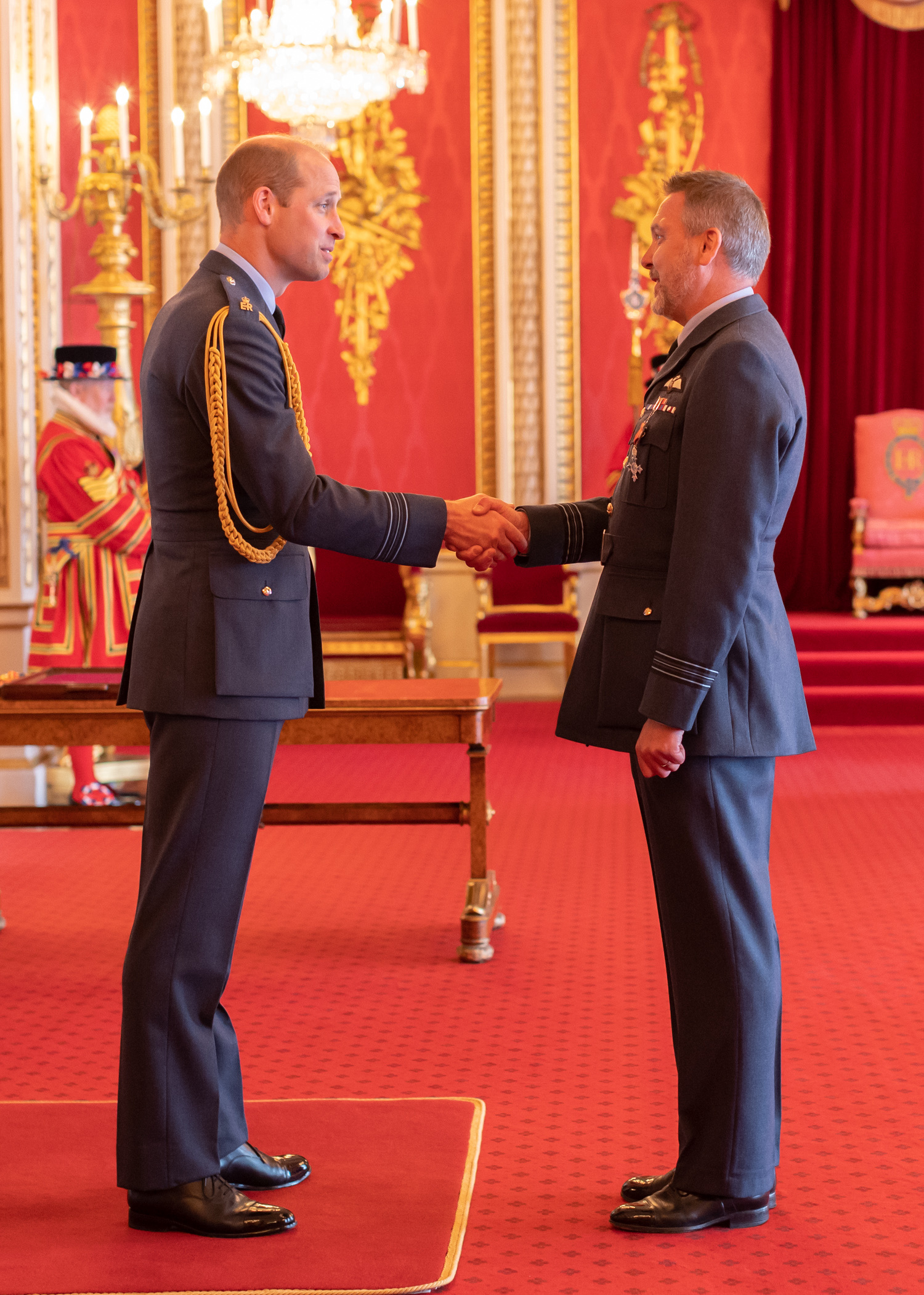 Image shows RAF aviator shaking hands with His Royal Highness Duke of Cambridge.