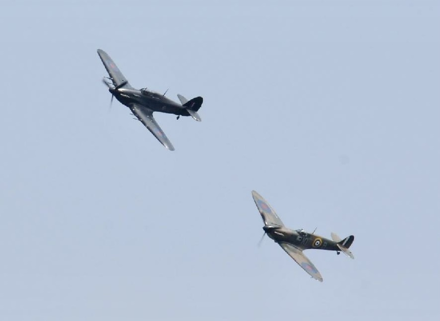 Image shows spitfire and Typhoon in flight.