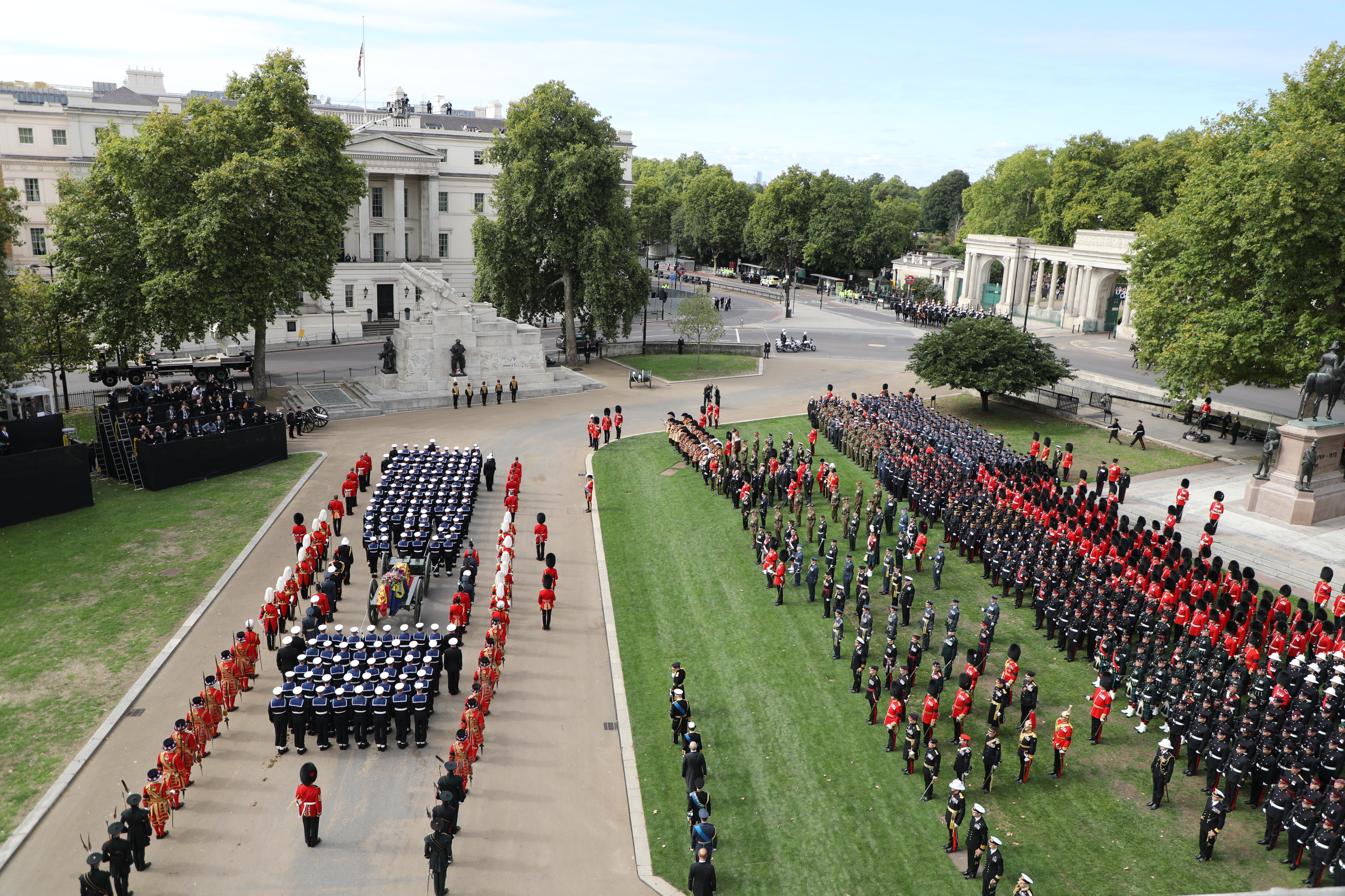 Image shows the Armed Forces on parade towards Buckingham Palace.