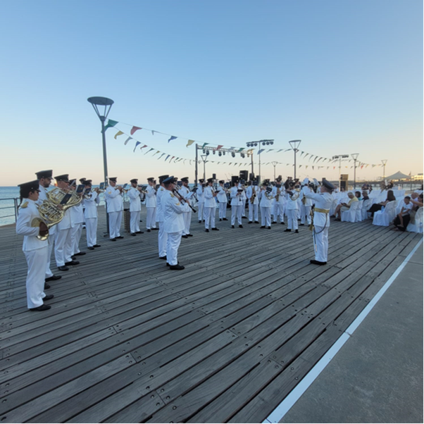 Image shows RAF Music Band performing on the deck of a ship.