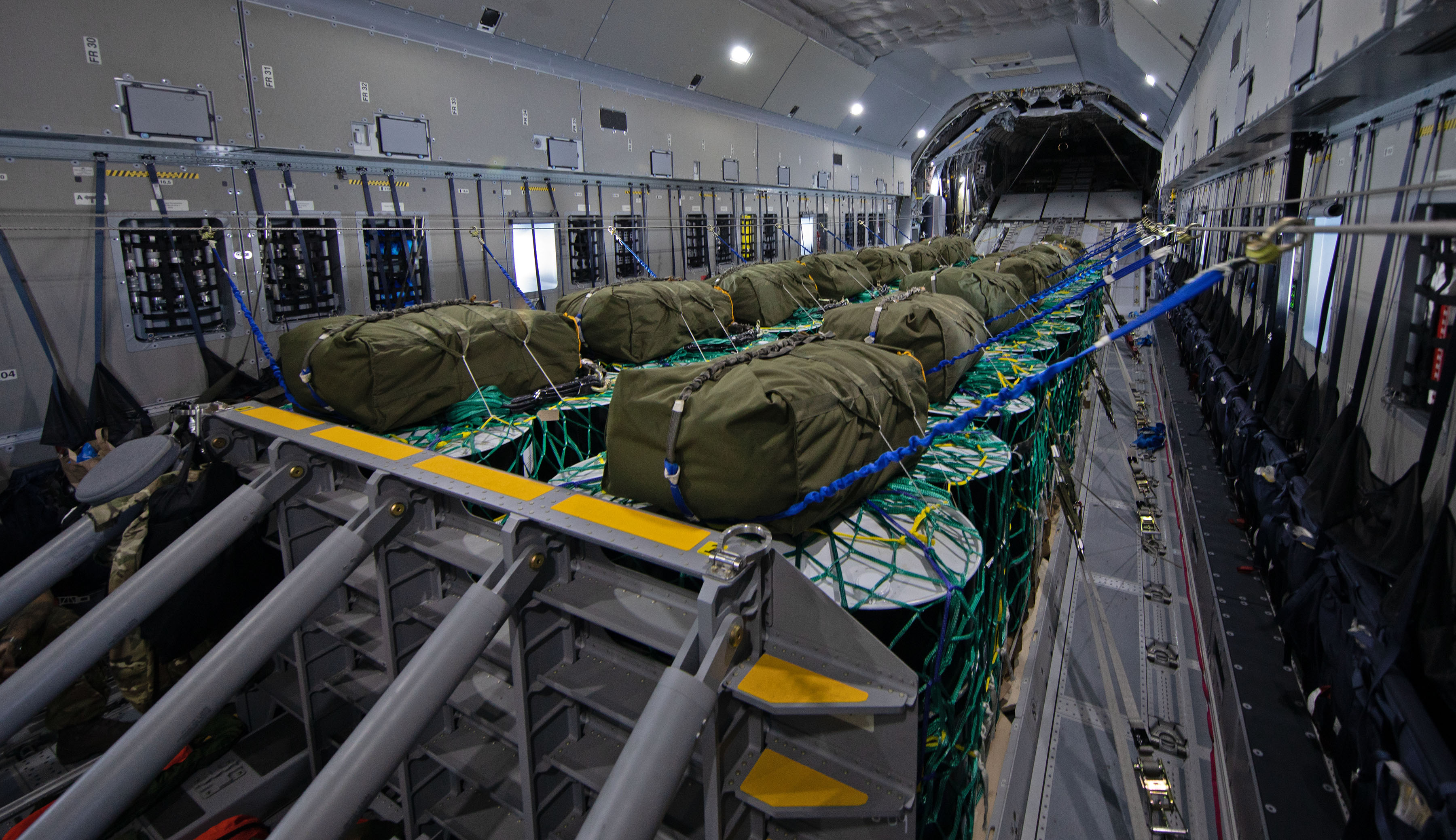 Image shows cargo inside the holding bay of a carrier aircraft.